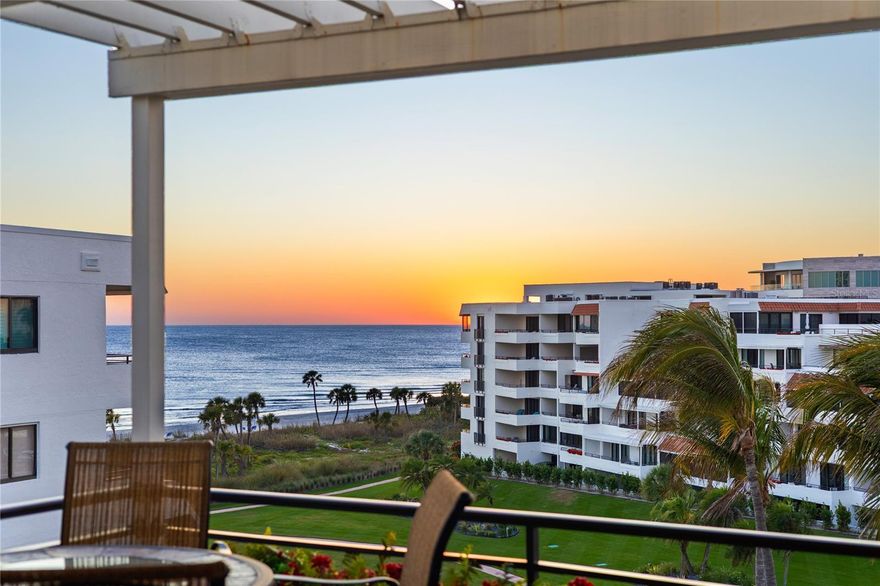 This stunning corner penthouse spans over 2,800 sq. ft. and boasts breathtaking views of the Gulf, Bay, and city skyline. Key features include elegant stone floors, storm-resistant windows, custom cabinetry, skylights, raised ceilings, and indirect lighting. The kitchen offers a breakfast bar and an adjacent Solarium, perfect for enjoying your morning coffee while taking in both Gulf and city vistas. The spacious sitting room/office adjacent to the primary bedroom features built-in desk and shelving, with expansive glass walls overlooking the pool and Gulf. For entertaining, the impressive 800 sq. ft. private courtyard includes a large fountain and a summer kitchen. This residence also includes a private garage and an additional assigned under building parking space. Residents of The Players Club enjoy a guarded entrance, on-site management, a resort-style saltwater pool and cabanas, spa, Har-Tru tennis courts, pickleball, putting green, a fitness center, renovated clubhouse with catering kitchen, outdoor entertainment area with fire pits, barbecue grills, and direct access to a white sand beach. All of this is just minutes away from the vibrant shops, restaurants, theaters, and art galleries of St. Armands Circle and Downtown Sarasota.