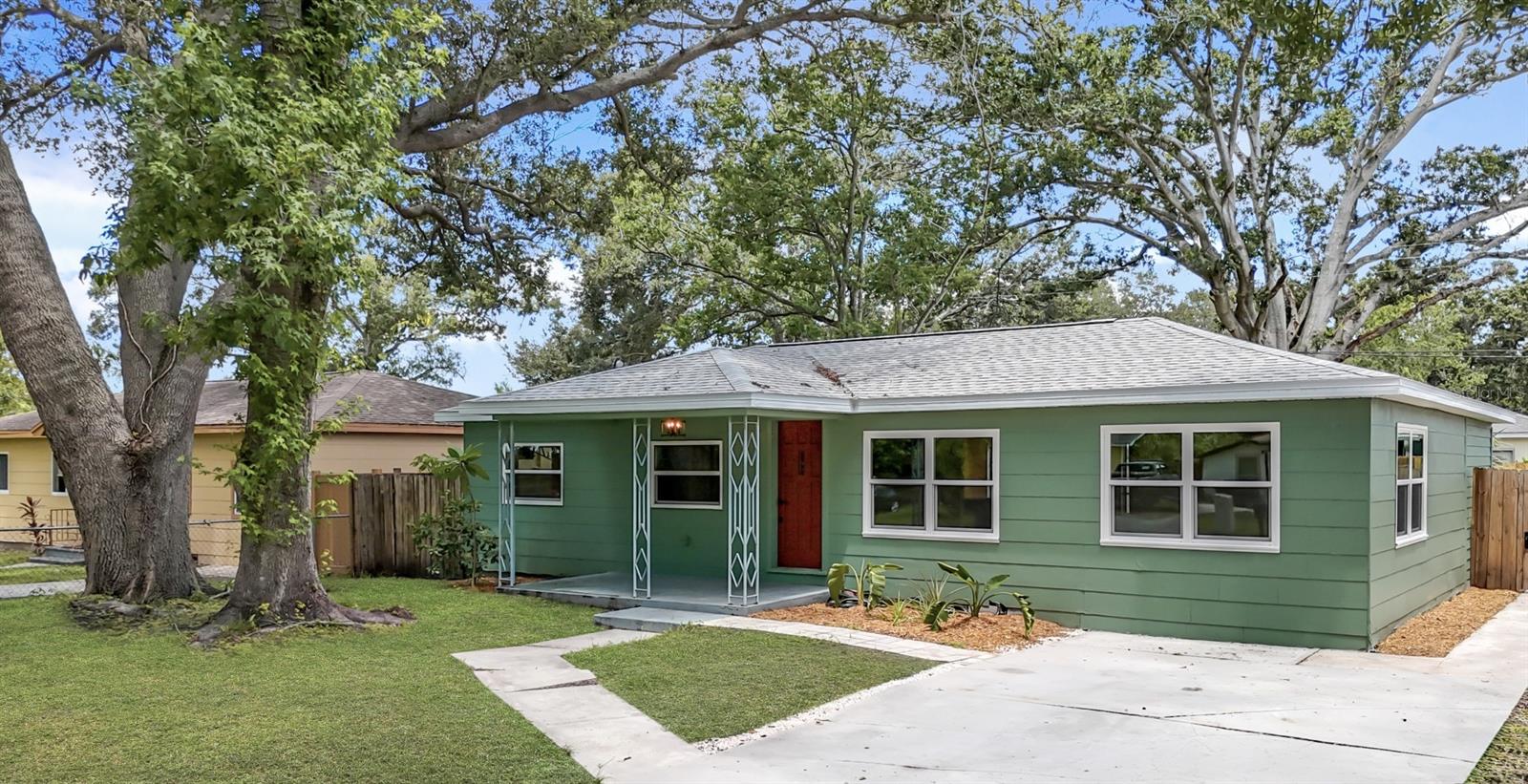 One or more photo(s) has been virtually staged. Are you tired of cookie-cutter homes? Welcome to a charming residence where vintage character meets everyday comfort! This delightful 3 BEDROOM, 1 Bath home in St. Petersburg combines timeless style with modern updates, making it perfect for those who appreciate classic details with contemporary ease. ***NEW ROOF (2024), AC (2019), Most windows impact-rated (2021).*** Centrally located in UNINCORPORATED PINELLAS COUNTY - FLOOD ZONE X (no flood zone), NON-EVACUATION ZONE, with NO HOA or CDD fees! From the moment you arrive, this home's irresistible charm will capture your heart! Situated at the END of a quiet road, the property features serene, mature landscaping and a covered front porch that invites you to sit back and relax and soak in the Florida lifestyle. Inside, you'll love the original wood floors that flow throughout the living space and secondary bedrooms, along with a beautiful wood accent ceiling and a light-filled OPEN FLOOR PLAN. The living room is versatile, allowing for various layouts - whether you need double seating areas, a play space, or a home office. It seamlessly connects to the dining area and kitchen, which boasts a breakfast bar, penny tile flooring, a custom accent backsplash, stainless steel appliances, and a window overlooking the rear yard. The impressive primary suite features elegant high ceilings and tile flooring, enhancing the overall design and flow. This spacious suite can easily serve as an additional living area, bonus room, or game room if desired. There's also an inside utility/bonus room just off the primary bedroom that has the potential to become your dream en suite spa-like bathroom. Bedrooms 2 and 3 are generous in size and share a hall bathroom with a tiled walk-in shower. Step outside to your fully fenced backyard, perfect for enjoying fun times with family and friends. The expansive yard offers plenty of privacy and room to create your own personal oasis. This home's location is just MINUTES away from all the fun and excitement that DOWNTOWN ST PETE, MAZZARO'S ITALIAN MARKET, TOBY'S ORIGINAL LITTLE ITALY PIZZA, Gladden Park Recreation Center, Vinoy Park, Gulfport, and the Beaches have to offer! With EASY access to major roads, schools, sports and concert venues, shopping, dining, airports, and medical facilities, everything you need is within reach. Don’t miss this opportunity to own a unique piece of St. Pete history and comfort! Whether you choose to live in it, rent it out, or expand, the possibilities are endless! Be sure to schedule your private showing today - you will love what you see!