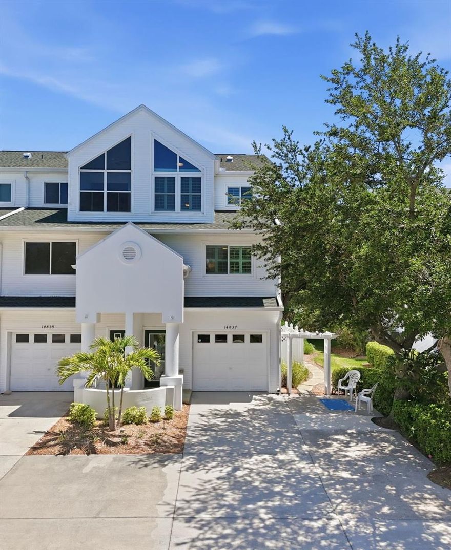 Welcome to Tara Cay Sound North Village—this beautifully maintained WATERFRONT END-UNIT three-story townhome offers 2,174 heated square feet, a DOUBLE-WIDE DRIVEWAY, and a flexible layout with 3 bedrooms and 4 full bathrooms—ideal for multi-generational living, guests, or working from home. This is where waterfront living, space, and lifestyle come together in one of Seminole’s most sought-after communities. Just this week, manatees were seen playing in the canal as a roseate spoonbill soared overhead—your new everyday backdrop.
Surrounded by mature trees and peaceful, tree-lined streets, the setting is both serene and inviting. Inside, the open-concept main living level features a well-appointed kitchen with a gas stove, updated cabinetry and countertops, and a dining bar, all flowing seamlessly into the spacious living and dining areas. A propane fireplace with built-ins adds warmth and character, while sliding glass doors lead to a screened balcony—perfect for enjoying coastal breezes and tranquil water views.
The ground level offers a one-car garage with abundant storage, along with a large bonus room and full bathroom—ideal as a guest or in-law suite, game room, home gym, or office. Sliders open to a covered, screened patio just steps from the water and nearby community docks, which may be used for short-term docking (per HOA guidelines).
Upstairs, the top floor features two private suites, both with vaulted ceilings and en suite bathrooms. The south-facing primary suite includes dual closets, a walk-in shower, and access to a private screened waterfront balcony. The north-facing suite offers a bonus flex space—perfect for an office, reading nook, or lounge. An additional bedroom and full bath are conveniently located on the main living level.
Enjoy the best of Florida outdoor living with screened balconies on every level, plus access to community docks for kayaking, paddleboarding, and fishing. The heated community pool is just steps away.
Notable Updates & Features (partial list):
Hurricane windows (2023)
New roof (2024)
A/C (2022)
Updated kitchen, faucets, toilets, and shower door
Propane tank
Crown molding
Additional side concrete patio
Plantation shutters
Updated hinges and door handles
Indoor laundry (upper level)
Optional chair lift for added accessibility
Tara Cay North Village is a pet-friendly, park-like waterfront community with lush green space and a low $417/month HOA, which includes the heated pool, water, sewer, trash, basic cable, and internet.
Located just 2 miles to Indian Rocks Beach, and minutes to shopping, dining, and top-rated Seminole schools, with easy access to St. Pete, Clearwater, and Tampa International Airport.
No flooding or storm damage in the North Village.
This is your opportunity to own a spacious waterfront townhome offering comfort, flexibility, and the ultimate Florida lifestyle.