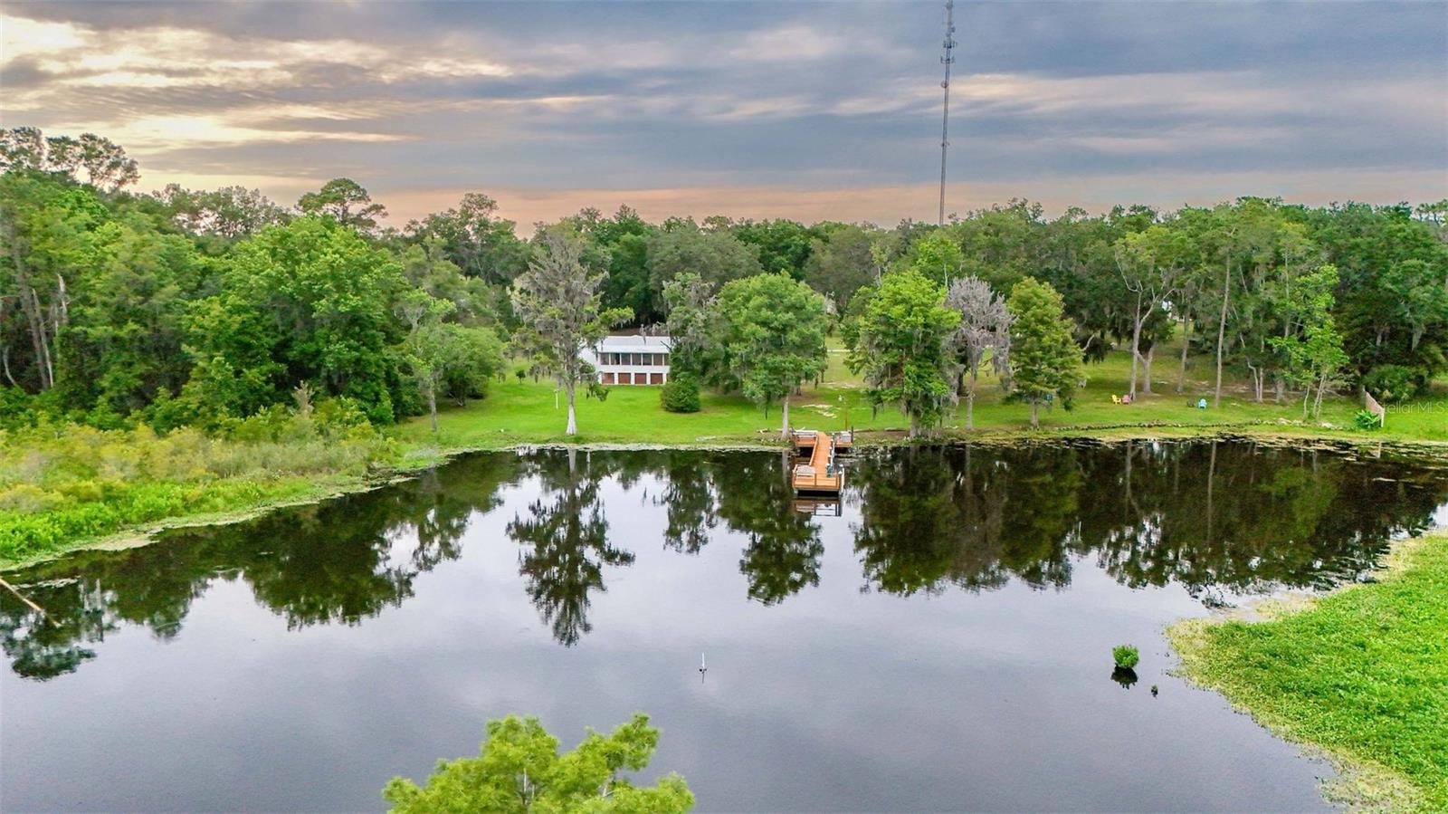 FLORIDA'S GREAT WATERFRONT LIVING AT IT'S FINEST!!! GREAT INVESTMENT PROPERTY & INCOME POTENTIAL!!! RENTALS ALLOWED!!! A GORGEOUS 6.4 ACRES WITH 325 FEET OF WATERFRONT, 5 MANUFACTURED HOMES, RV HOOK UPS, RV W/ WATER, SEWER AND ELECTRIC IN BARN WORKSHOPS & STORAGE BUILDING. PROPERTY INCLUDES 75 FT DOCK WITH 2 PLATFORMS WITH ELECTRIC & WATER STATIONS. LOCATED ON BEAUTIFUL & TRANQUIL LAKE ROUSSEAU MINUTES FROM THE CRYSTAL CLEAR RAINBOW RIVER. THE POSSIBILITIES ARE ENDLESS. MANUFACTURED HOMES HAVE NEWER ROOFS 2022-23, 4 WELLS, 6 SEPTIC TANKS, FURNITURE IN RENTALS STAY, ALL APPLIANCES INCLUDED IN ALL UNITS. EQUIPMENT, LAWN MOWER, GOLF CARTS AND TOOLS ARE NEGOTIABLE. PLAYFUL CRANES, CARDINALS, BLUE BIRDS & WILDLIFE MAKE THEIR HOME ON THIS PROPERTY. ENJOY SOME OF THE BEST FISHING IN FLORIDA ON LAKE ROUSSEAU. NOT A WATER PERSON, THERE'S HIKING, BICYCLING AND HORSE BACK RIDING ON THE WITHLACOOCHEE TRAIL OR GOETHE STATE FOREST. DESIRABLE QUIET COUNTRY SETTING CLOSE TO SHOPPING, RESTAURANTS AND ENTERTAINMENT. **COME MAKE THIS YOUR DREAM HOME!!! **INVESTORS DON'T MISS THIS OPPORTUNITY!!! CALL AGENT FOR MANY MORE GREAT DETAILS!!!! APPT ONLY. SELLER MAY CONSIDER OWNER FINANCING. THERE IS NO PLACE LIKE THIS, SO THIS MUST BE THE PLACE.