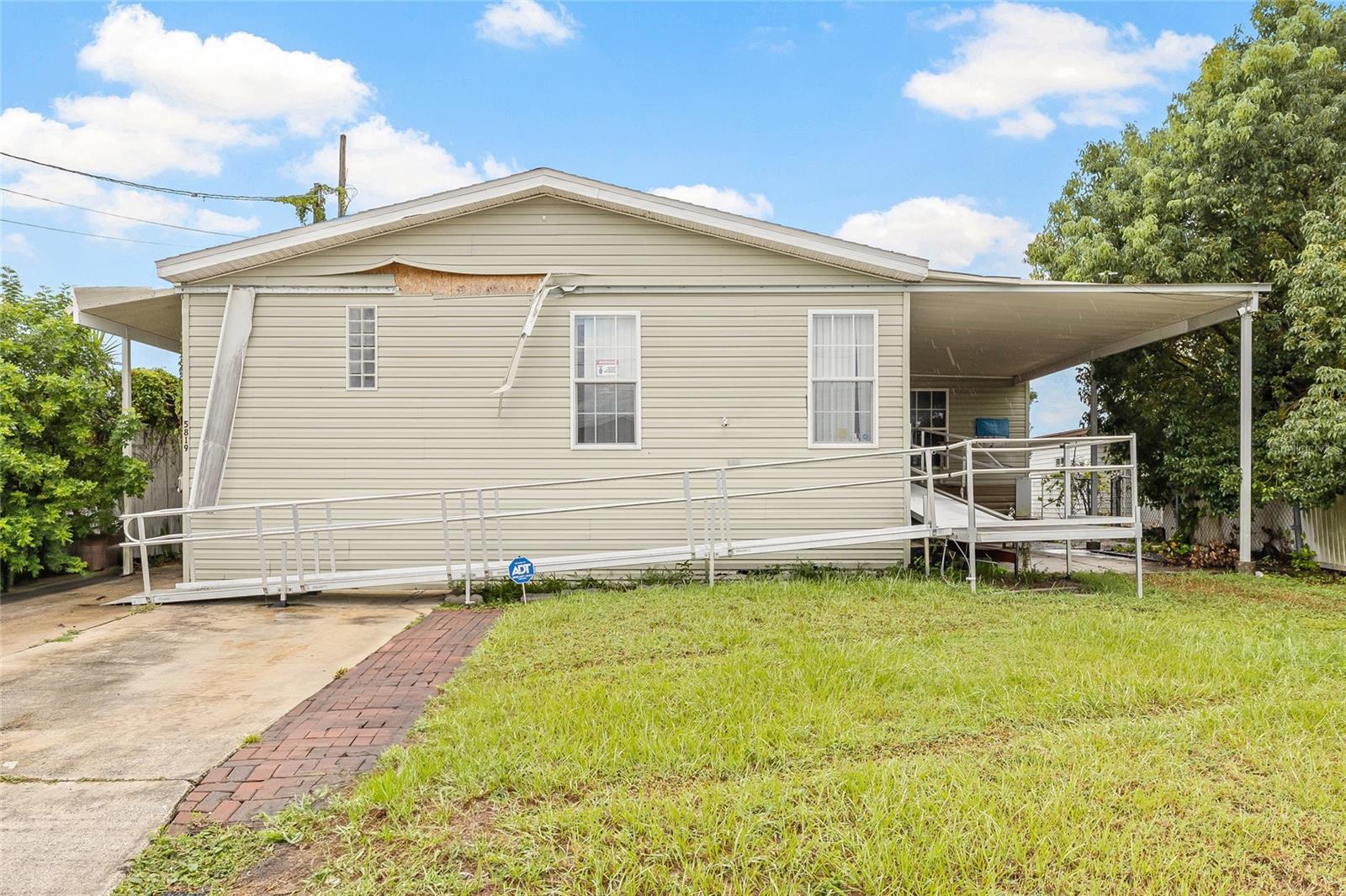 Bring your vision and make this spacious waterfront property your dream Florida retreat! This 4-bedroom, 2-bathroom manufactured home with high ceilings and an open-concept layout offers incredible potential, plus a rare unfinished attached in-law suite. Nestled on a saltwater canal with direct access to Old Tampa Bay, you can fish, boat, or kayak right from your backyard. Best of all—there’s no HOA, no community fees, and no lot rent. You own the land outright! Step inside to discover a bright and airy floor plan combining the living room, dining area, and kitchen, perfect for gatherings and everyday living. The kitchen features a center island, refrigerator, range, dishwasher, and microwave. The spacious primary suite includes a walk-in closet and ensuite bathroom, while three additional bedrooms and a full guest bath are located on the opposite side of the home. A versatile family room opens to a covered back deck with canal views—ideal for enjoying your morning coffee or evening sunsets. Conveniently located off the kitchen, you’ll also find a laundry room. The attached in-law suite is a fantastic bonus, currently unfinished but offering endless possibilities. With space for a bedroom, bathroom, kitchen, and small living/dining area—and its own sliding glass doors overlooking the canal—it’s perfect for multi-generational living, guests, or future rental income. While the home needs some TLC, the location, layout, and waterfront setting make it a rare opportunity. Enjoy quick access to Tampa International Airport, top-rated restaurants, shopping, and outdoor activities, all while living just 20 minutes from Downtown Tampa. Don’t miss your chance to transform this hidden gem into your ideal waterfront escape!
