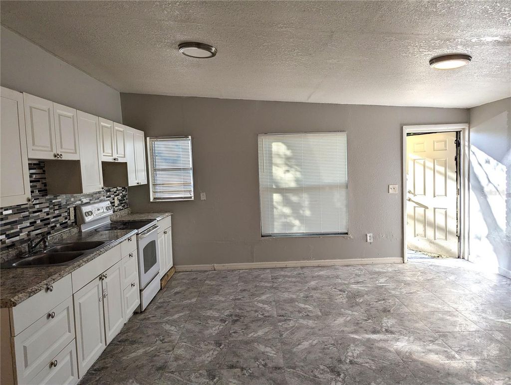 Photo of 8713 N Mandarine Place, Tampa, FL 33617 (MLS # TB8459016)