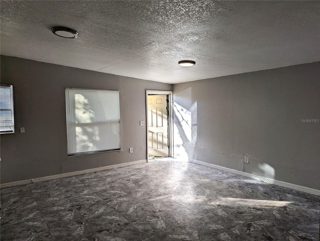 Photo of 8713 N Mandarine Place, Tampa, FL 33617 (MLS # TB8459016)