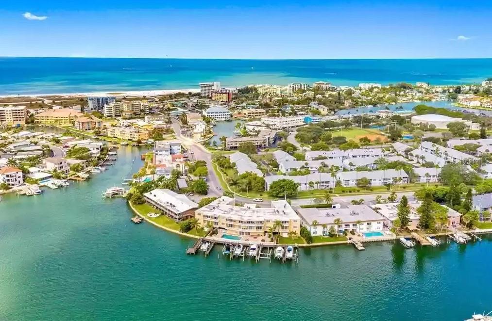 Beautiful, totally remodeled, upscale 2 bed room/2 bath Penthouse Overlooking gorgeous water views on popular Treasure Island. Stunning ceramic tile throughout with granite countertops in kitchen, bar and bathrooms. Crown molding w/ recessed lighting. Extended balcony from living room to master bedroom With fantastic water views. Split-plan bedroom with guest bedroom suite, inside washer/dryer with community laundry 2 steps away . Unit 305 is located right next to the elevator, allowing easy entry from the covered parking space in garage. Fitness room, swimming pool, grilling area and dock. Walking distance to beach. Contact agent for further information .