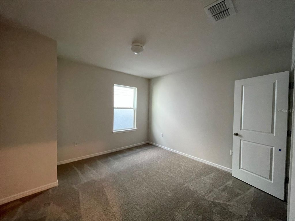 Photo of 9675 Rally Spring Loop, Wesley Chapel, FL 33545 (MLS # TB8442244)