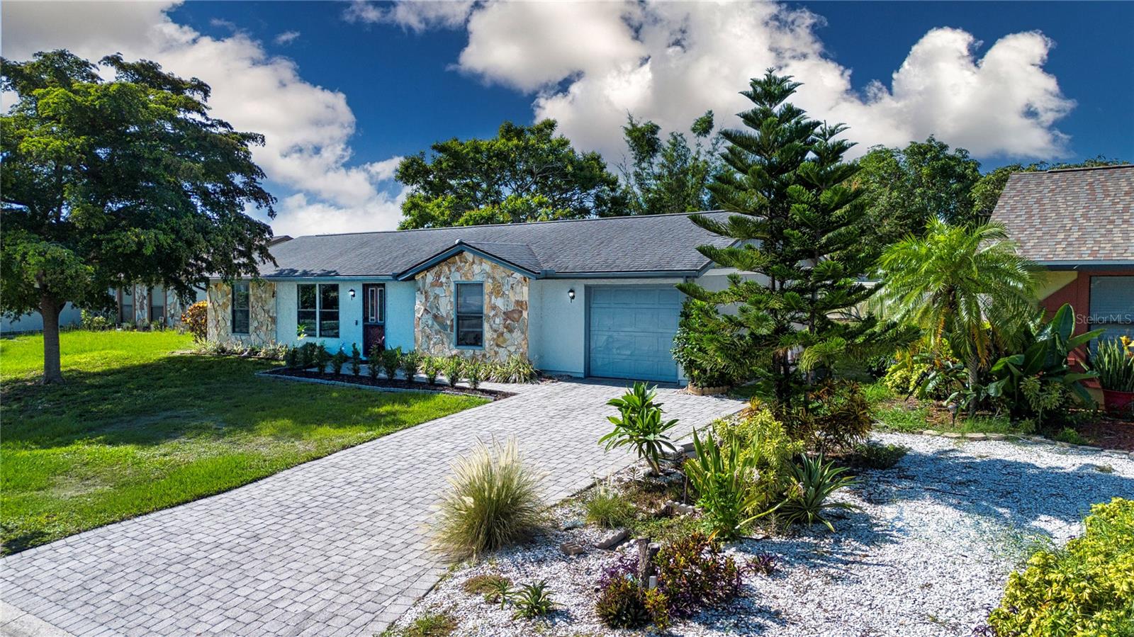 Positioned in the established community of Cordova Lakes, this gem may be the one that you have been waiting for. From the moment you arrive you will notice the attention to detail, from the paver drive and walkway to the natural stonework that anchors the façade and greenery of the hedge. Through the leaded glass entry door you will discover rich wood floors that flow from living to dining room. Sliding glass doors in the dining room allow both additional natural light and a perfect view of your lanai and outdoor space; offering seamless living and entertaining. The kitchen includes stainless appliances, eat in space and a pantry. The split bedroom floor plan provides room for family, guests or office space and privacy for all. Spacious en-suite master bedroom is a wonderful place to retreat, complete with a walk-in closet. Screened lanai provides the perfect place for morning coffee while enjoying the tranquil water view. With enough space for your outdoor toys, gardening shed, or even to add a pool and create your own sanctuary or garden ~ complete with a Mango tree, this is what Florida living is all about! Added bonus; Roof 2019, AC 2021, applicances less than 5 years old. Without HOA , restrictions or rental limitations, imagine the unlimited possibilities! Conveniently located to shopping and dining, Blake Hospital, GT Bray park, with access to nature preserves, Gulf beaches and Anna Maria Island, this may be the perfect place to call home. Whether looking for a permanent residence, vacation home or to add to your investment portfolio, this is the one not to miss.
