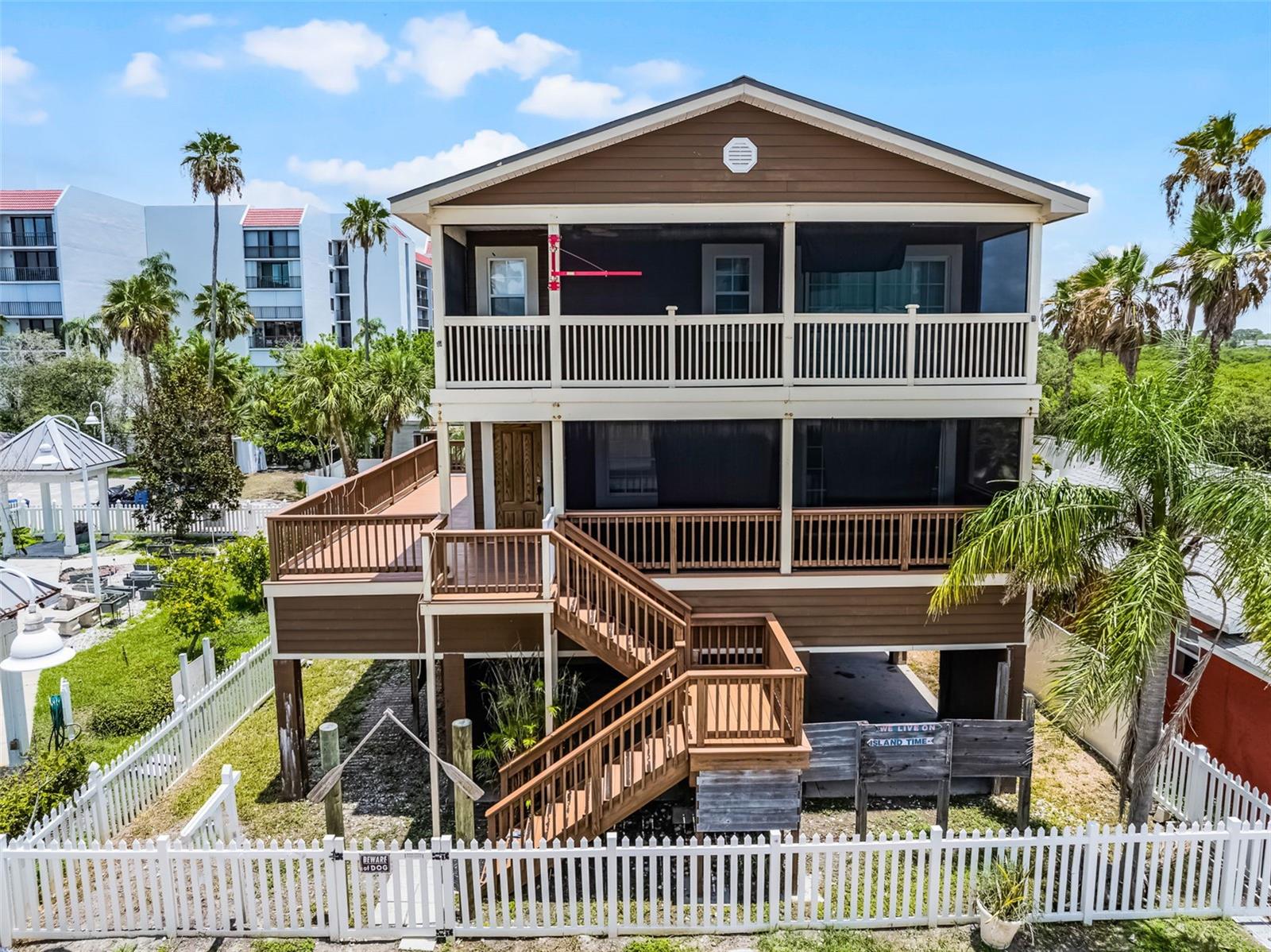 Spacious 2 bed, 2 bath Key West-style charmer — just a stroll away to the Gulf Beaches! This cute beach house needs some TLC — bring your hammer, creativity, and vision to transform it into your ultimate seaside sanctuary. Priced to sell and bursting with endless potential, this is your chance to build instant equity in a neighborhood where homes routinely hit over a million+. Imagine sipping sunrise coffee on a sunlit deck, or crafting coastal-inspired interiors with your own personal flair. No HOA fees — just pure artistic freedom and beachfront living at its best.