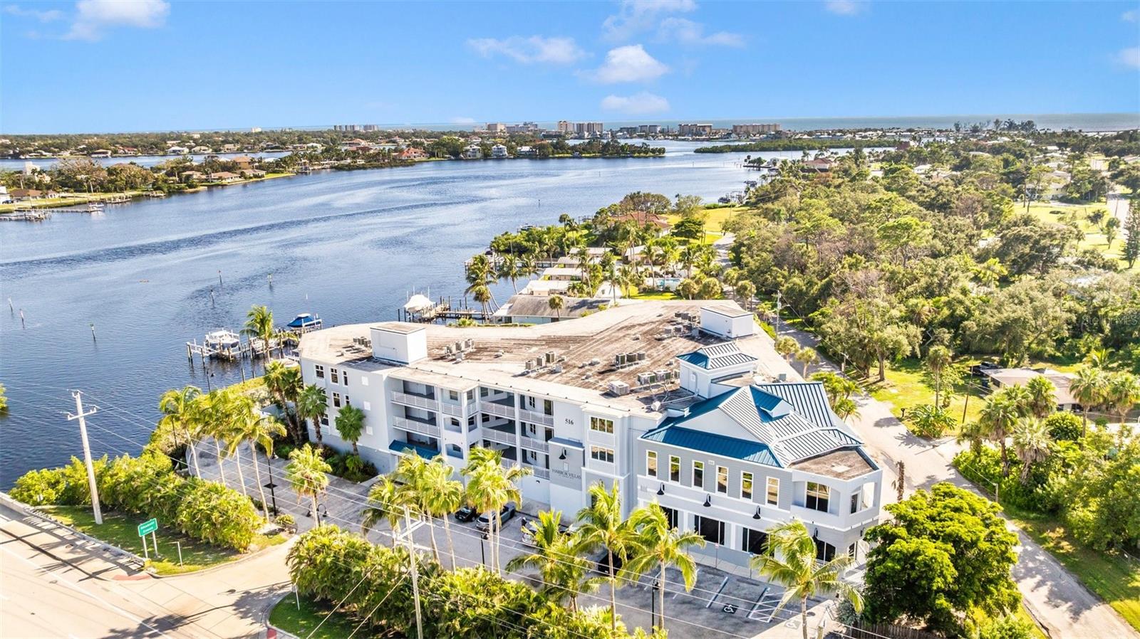 Discover waterfront luxury living at Harbor Villas at Doná Bay in this stunning 3-bedroom, 3.5-bath residence offering over 2,300 square feet of elegant space with high ceilings and Luxury Vinyl Plank flooring throughout. This home is being sold turn-key furnished with two bicycles and two kayaks and features an open floor plan with a spacious living and dining area that flows into a gourmet kitchen with pantry and table space, perfect for both entertaining and everyday living. Each bedroom has its own en-suite bath, while the master suite boasts sliding hurricane-rated glass doors that open to a private balcony overlooking Doná Bay, where you can enjoy tranquil sunrises and breathtaking sunsets on the water. The two front bedrooms overlook sunrise views on Shakett Creek. Designed with privacy in mind, the split layout provides comfort and functionality. Large Balcony with ceiling fans provides gorgeous saltwater views of Dona Bay. Community amenities include a heated pool, spa, fitness room on 4th floor, and 2 reserved parking spaces in secure garage on ground floor with bicycle rack and kayak storage, boat dock with kayak lift with direct access to the Intracoastal Waterway and Gulf to enjoy the sandbar, small islands and all salt water life has to offer. Ideally located just minutes from Nokomis, Venice, and Sarasota beaches, this is not only convenien and beautiful, this offers life balance in one of Southwest Florida’s most desirable settings. All dock measurements and other measurements and information must be verified by buyer; info provided is approximate and to best knowledge of seller but seller makes no warranty.