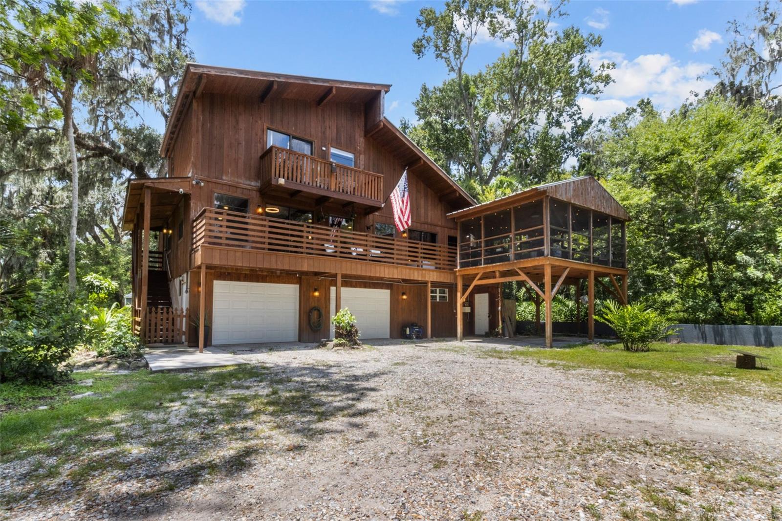 Just 35 minutes from Tampa, down a quiet drive and behind a private gate, awaits a rare and remarkable retreat: 10.1 secluded acres with no HOA, a fully stocked pond, creek, and wildlife - all wrapped around a lovingly maintained, one-of-a-kind custom home. And yes, it even comes with its own ATV and trailer included with the sale.
Built in 1982 and owned by two families, this peaceful property welcomes you with the warmth of a well-loved home and the magic of true Florida nature. Grab your fishing pole and head out to the pond, where tilapia and bass await. Wade through the gentle creek that winds behind the home, or blaze your own trails beyond it - on foot or ATV. With man-made berms along the rear boundary, wide-open fields, and towering trees, the land itself invites you to slow down, breathe deep, and start living.
The home rises across three levels, beginning with a ground floor that includes garage space, a carport, and ample storage. The main living area sits on the second floor, where the kitchen, dining, living, and family room flow together with large windows and doors opening to panoramic views. A bedroom with its own bathroom and an additional guest bath make this level ideal for everyday living or multigenerational needs. In 2009, a spacious suite and bath were added to this level (not yet reflected in public records), enhancing comfort and privacy.
Upstairs, you'll find three more bedrooms - including the serene primary retreat with its own private balcony and treetop views, along with one shared bathroom. Throughout the second and third floors, vaulted ceilings, exposed wood beams, and new vinyl plank flooring give the home a fresh yet rustic charm.
Step outside to the screened-in sitting room or one of two open-air balconies to watch wild life by - and, on rare days, perhaps even a Florida panther. The elevator lift, located next to the carport, provides added ease between two levels. Recent updates totaling over $50,000 include new electrical mains ran, EV charger, outlets and switches, interior paint, ceiling fans, light fixtures, custom blinds, hardware, and both garage and exterior doors + a whole-house water softener and filtration system with reverse osmosis in the kitchen ensures clean, safe water at every tap.
Outside, the property continues to shine with a metal roof, three sheds, and a 50-amp RV hookup. The crown jewel? A huge, custom-built pole barn with full electric - perfect for events, weddings, gatherings, RV storage, or your next big project. And for electric vehicle owners, an EV charger is already installed (Tesla charger negotiable, wiring remains).
From hosting friends under the stars to wandering the woods in total quiet, this home is more than a place - it’s a feeling. Private. Peaceful. Free. Yet somehow still just a short drive from city life, shopping, dining, and beaches.
Acreage like this, with updates, charm, and soul - so perfectly nestled between Tampa and Orlando - is truly a rare find. Come get your slice of paradise and make it yours - however you want!