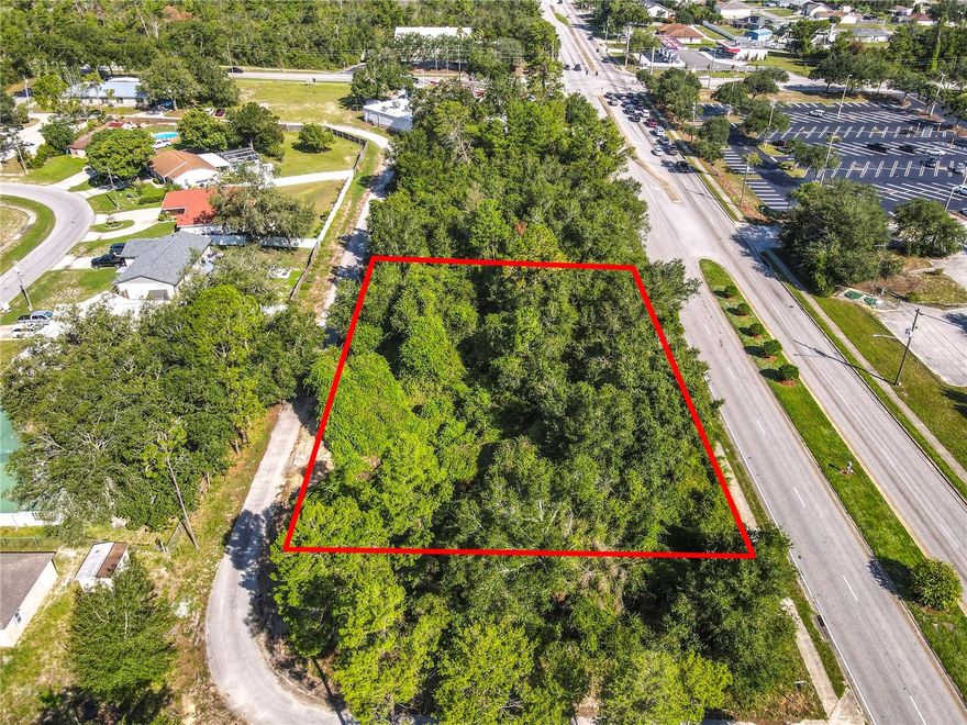 PRIME COMMERCIAL LOT – 0.69 ACRE ON BOOMING HOWLAND BLVD, DELTONA!Rare opportunity to secure a strategically located commercial lot in one of Volusia County’s fastest-growing corridors. This 200’ × 150’ parcel sits directly on high-traffic Howland Boulevard, surrounded by major retailers, new development, and just minutes from the Amazon distribution center.Despite the explosive growth in this area, this parcel remains available—making it a standout chance to establish your business in a market where lots don’t last.Site Features:    •    Unmatched visibility: 200’ of frontage on a primary thoroughfare.    •    Fully serviced: Public water, sewer, and cable ready at the curb.    •    Zoning versatility: C-1 zoning allows for restaurants, medical, office, retail, self-storage, multi-family, and more.    •    High growth demand: Serves a trade area of over 100,000 residents, with quick access to SR 415, I-4, Deltona City Hall, AdventHealth’s Deltona hospital, and Amazon.    •    Development ready: Survey and preliminary five-unit plan available.    •    Flexible terms: Owner may consider partial financing (50% down, 3-year term).This location is tailor-made for businesses that thrive on traffic, convenience, and visibility. Whether you’re planning a franchise, medical facility, or income-generating development, this lot delivers prime positioning in a market that’s only getting hotter.