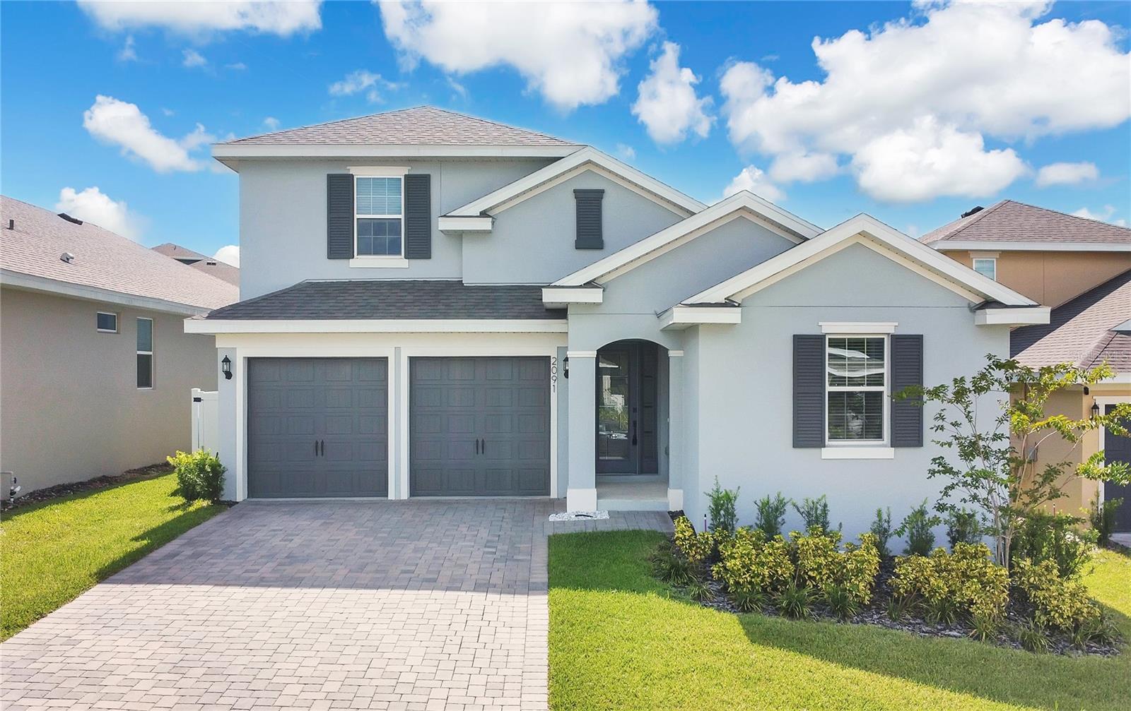 Step inside this stunning 5-bedroom, 3.5-bath home, built in 2024 in the sought-after Hills of Minneola, and feel the perfect balance of space, style, and comfort. From the moment you enter, natural light fills the open floorplan, guiding you toward a gourmet kitchen that will inspire every meal—featuring a striking quartz island, elegant backsplash, range hood, cooktop, separate oven, and built-in microwave. The seamless flow into the living and dining areas makes entertaining effortless, while keeping everyday moments just as special.
Your master retreat awaits on the first floor, complete with a custom wood-designed walk-in closet, a spa-like bathroom with a glass-enclosed shower, a private enclosed toilet, and thoughtfully designed storage. Upstairs, airy bedrooms with ceiling fans provide flexibility for guests, a home office, or a playroom. Beautiful wood stairs add warmth and elegance as you move between floors.
Practicality meets style in the laundry room with cabinetry and a utility sink, and the two-car garage with epoxy floors and overhead racks keeps everything organized. Step outside to your fully fenced backyard and relax in the screened-in lanai—perfect for morning coffee or sunset gatherings.
Every detail has been considered, from the whole-house water filtration system and reverse osmosis in the kitchen to the quality finishes throughout. Enjoy resort-style living with a community pool and amenities, all just minutes from the new hospital, schools, Florida Turnpike, and world-class theme parks. Move-in ready—this property, with all its features and upgrades, is a great opportunity in today’s market. Schedule your showing today.