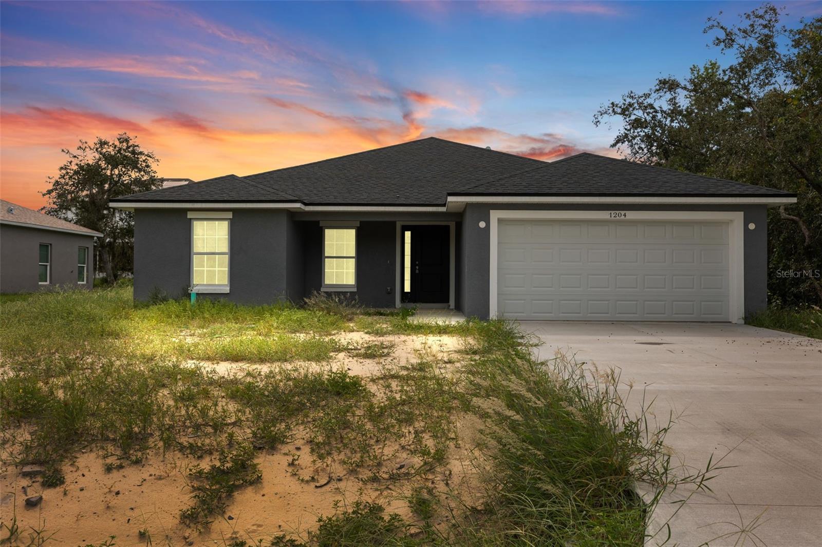 Welcome to 1204 Alafia Way in Kissimmee, a brand-new 4-bedroom, 2-bathroom home offering 1,780 square feet of modern living space on a 7,501 square foot lot. Designed with an open-concept layout and soaring ceilings, this home features a bright gourmet kitchen with quartz countertops and stainless steel appliances including a convection oven, cooktop, dishwasher, microwave, and refrigerator, with washer and dryer also included at closing. Each bedroom offers ample natural light, the bathrooms showcase sleek contemporary finishes, and the primary suite provides a private retreat. Built with durable block construction and a classic shingle roof, this home is both energy-efficient and low-maintenance. Additional highlights include an attached garage and convenient location near Lake Marion Creek Elementary and Middle Schools, Haines City Senior High, and just minutes from the shopping, dining, and amenities of Poinciana Lakes Plaza on Cypress Parkway and Marigold Avenue. Move-in ready at closing, this home blends comfort, style, and strong investment potential.