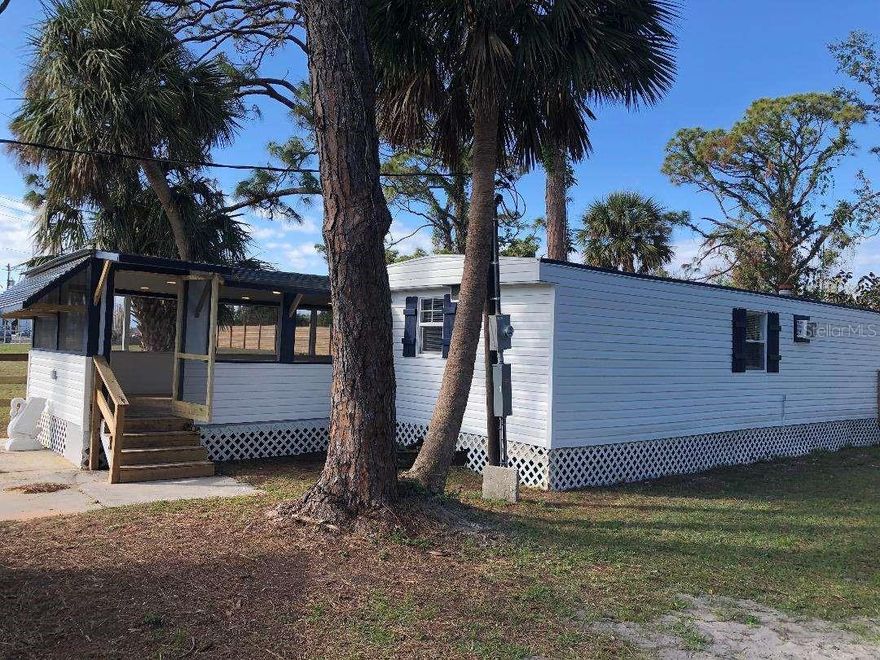 Residential/Commercial over 150+ frontage HWY 775 englewood ZONED OMI office,medical,inddustrial also zoned for Duplex, posable Tri-plex lot is Completeley fenced in and secure! 2 bedroom 1 bathroom move in ready! large deck, leni, all tile and hardwood floors s/s applinces comes with GE washer / dryer 2 small out buliding and 1 shead included!