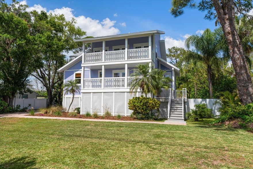 Tucked within the quaint, coastal village of Ozona, this quintessential Key West–style residence captures the essence of relaxed “Old Florida” living with timeless charm and thoughtful updates throughout. Raised construction, a 2023 roof, and newly installed blonde hardwood floors (2025) provide both peace of mind and a fresh, coastal aesthetic.

Rich in architectural character, the home features vaulted ceilings, abundant natural light, and a unique widow’s peak offering a bird’s-eye view of the surrounding treetops and coastal landscape. Two inviting front decks and dual screened porches in the rear create seamless indoor-outdoor living, ideal for enjoying breezes year-round.

The oversized, lushly landscaped lot is a true backyard retreat, complete with an exceptionally large pool and sun shelf, perfect for entertaining, family gatherings, or quiet afternoons at home. The setting is equally suited for outdoor play, pets, and lively weekend barbecues.

Located just moments from multiple marinas, waterfront restaurants, and local favorites, this home places you at the center of Ozona’s vibrant yet laid-back lifestyle. Enjoy easy access to the Pinellas Trail, and a short drive to the pristine beaches of Honeymoon Island State Park.

Positioned within one of North Pinellas’ most beloved, family-friendly communities—known for its top-rated schools, golf cart culture, and strong sense of community, this is a rare opportunity to own a home that embodies both charm and quality of life.