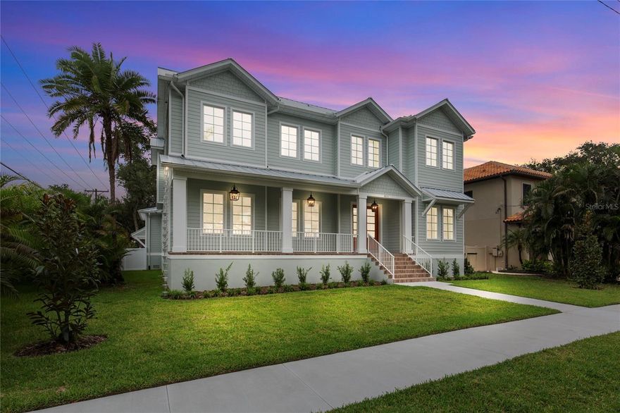 COMPLETE AND MOVE-IN READY! This one-of-a-kind two-story block construction residence by Southerlyn Homes delivers nearly 5,000 sq. ft. of refined living space with 5 bedrooms and 6 baths, set on an oversized 75x120 corner lot in the heart of prestigious Virginia Park. Built well beyond code with an elevated foundation, standing seam metal roof, Hardie siding, impact-rated windows/doors, and a sealed building envelope with mechanical ventilation, the home is designed for timeless curb appeal and lasting durability. Southerlyn Homes never builds the same house twice, and this custom plan showcases bespoke architectural details and thoughtful spaces throughout—making it unlike any other new construction home on the market. Representing one of the best new construction values in South Tampa, this residence combines architectural distinction, advanced construction, and thoughtful design in a way rarely found at this price point. Mature landscaping, a new privacy fence along Manhattan, and an extended rear fence create a secluded setting while expanding the usable backyard. Inside, 10-ft ceilings, 8-ft solid-core doors, wide-plank white oak flooring, and abundant natural light set an elegant tone. The chef’s kitchen features an oversized island, quartz counters, premium KitchenAid appliances including a 42” built-in refrigerator and 36” gas range, a walk-in pantry, and a butler’s pantry with wet bar and wine fridge. The open living area flows seamlessly outdoors to a covered lanai with summer kitchen, overlooking a fully automated saltwater pool and spa with heat/cool, sun shelf, LED lighting, and a newly completed shell-stone pool deck, complemented by a dedicated pool bath. The first-floor primary suite includes a spa-inspired bath with soaking tub, dual rain-head walk-through shower, dual vanities with makeup counter, and dual custom closets with built-ins and stacked washer/dryer hookup. Upstairs are four additional bedrooms—including two guest suites with private baths and a Jack-and-Jill—plus a large media/bonus room with full wet bar and beverage/wine cooler, and an oversized laundry room with extensive cabinetry. Additional upgrades include dual HVAC systems with UV purification, 400-amp electrical service, tankless gas water heaters, LED ambient/under-cabinet lighting, a 2-car garage with soaring ceiling and Wi-Fi opener, and a fully integrated smart-home system with security panels, surround-sound pre-wire, multiple speaker zones, Cat6 wiring, fiber internet, and hardwired Eero Wi-Fi. All closets are finished with custom built-ins, and the exterior includes zoned irrigation and underground electric for a clean streetscape. Walkable to shops and dining with effortless access to downtown, TGH, Westshore, International Plaza, and TPA, and zoned for Mabry, Coleman, and Plant schools, this Southerlyn Homes signature design delivers unmatched craftsmanship and a rare opportunity to own luxury re-imagined, never repeated—at a price point that makes it one of South Tampa’s best values today.