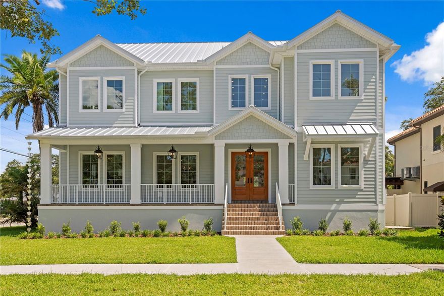 NOW COMPLETE & MOVE-IN READY.

This one-of-a-kind two-story block construction residence offers nearly 5,000 sq. ft. of refined living space with 5 bedrooms and 6 baths on an oversized 75x120 corner lot in the heart of Virginia Park. Representing one of the best values for high-quality new construction in South Tampa, this home delivers architectural distinction, advanced building science, and custom-level finishes rarely found at this price point.

Built well beyond code, the home features an elevated foundation, standing seam metal roof, Hardie siding, impact-rated windows and doors, and a sealed building envelope with mechanical ventilation—ensuring durability, efficiency, and long-term performance. Crafted by Southerlyn Homes—known for never building the same house twice—this bespoke floor plan reflects a commitment to originality and lasting craftsmanship.

Mature landscaping, a new privacy fence along Manhattan, and an extended rear fence create a secluded and expanded backyard setting. For buyers seeking additional parking or expanded driveway space, the builder is open to accommodating modifications—please inquire for details.

Inside, 10-ft ceilings, 8-ft solid-core doors, wide-plank white oak flooring, and abundant natural light establish an elevated yet inviting atmosphere throughout. The chef’s kitchen features an oversized island, quartz countertops, premium KitchenAid appliances including a 42” built-in refrigerator and 36” gas range, a walk-in pantry, and a butler’s pantry with wet bar and wine fridge.

The open-concept living area transitions seamlessly to a covered lanai with summer kitchen, overlooking a fully automated saltwater pool and spa with heat/cool functionality, sun shelf, LED lighting, and newly completed shell-stone deck. A dedicated pool bath enhances convenience for entertaining.

The first-floor primary suite offers a spa-inspired bath with soaking tub, dual rain-head walk-through shower, dual vanities with makeup counter, and dual custom closets with built-ins and stacked washer/dryer hookup.

Upstairs, four additional bedrooms—including two private guest suites and a Jack-and-Jill configuration—are complemented by a spacious media/bonus room with full wet bar and beverage/wine cooler, plus an oversized laundry room with extensive cabinetry.

Additional upgrades include dual HVAC systems with UV purification, 400-amp electrical service, tankless gas water heaters, LED ambient and under-cabinet lighting, a two-car garage with soaring ceiling and Wi-Fi opener, and a fully integrated smart-home system with security panels, surround-sound pre-wire, multiple speaker zones, Cat6 wiring, fiber internet, and hardwired Eero Wi-Fi. All closets are outfitted with custom built-ins, and zoned irrigation and underground electric preserve the clean streetscape.

Walkable to shops and dining with convenient access to downtown, TGH, Westshore, International Plaza, and TPA, and zoned for Mabry, Coleman, and Plant, this Virginia Park residence delivers enduring craftsmanship, architectural individuality, and exceptional value—positioning it as one of South Tampa’s most compelling new construction opportunities today.