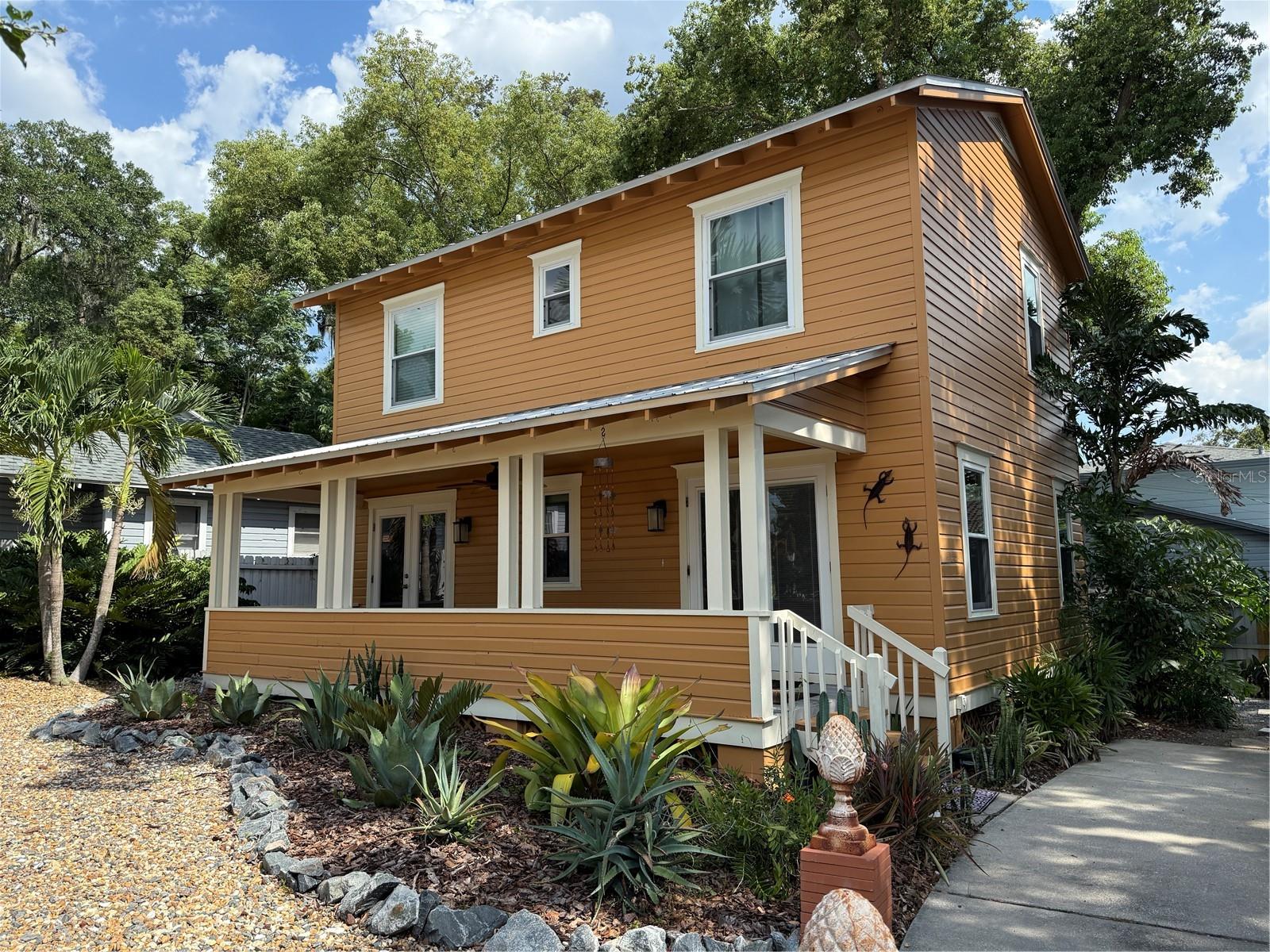 This fully renovated 2-bedroom, 1.5-bath bungalow is tucked away in the vibrant and walkable Mills/50 District. The open living area features vaulted ceilings and fills with natural light, creating a warm, welcoming space. The kitchen is outfitted with updated appliances, and the home also includes a washer and dryer, central HVAC, ceiling fans, and window blinds throughout. Original hardwood floors have been beautifully refinished, adding to the home's charm. Step outside to enjoy a spacious front porch and a private backyard, perfect for hosting or relaxing. You'll have the convenience of dedicated side-by-side off-street parking, and yard care is included in the rent. Just a short stroll to local favorites like Publix, cafes, restaurants, and neighborhood events—and only minutes from Lake Eola, Downtown Orlando, Lake Ivanhoe, AdventHealth, the Milk District, and SODO.