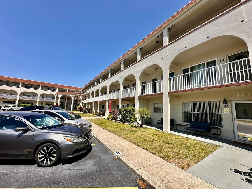This well-maintained 2 bed, 2 bath condo offers 1,100 sq. ft. of comfortable living in a vibrant 55+ community. Located on the second floor, it features impact-resistant windows and a tankless water heater for added efficiency. The HVAC system has been serviced annually, ensuring peace of mind for years to come. The building is fee simple, no land lease and the washer/dryer room is conveniently located on the same floor. Enjoy the benefits of a secure, active community with easy access to daily essentials and amenities. Assigned parking. The 55+ community has two activity centers, and two private golf courses with 9 and 18 holes, free exclusively for resident owners. There are two heated swimming pools. The remodeled Cardio Gym has the latest exercise equipment. A very pet- friendly community, there is a fenced dog park with covered seating. There are hobby studios, and a wood shop for the exclusive use of the residents. Activities include fitness classes, dancing, clubs, cards, billiards, entertainment, classes, and much more. The on-site Good Karma Café has take & bake meals and snacks. Close to beaches, transportation, shopping, entertainment, and fine dining. All room sizes, floor plans and square footage are approximate. This property is being transferred by a leasehold estate deed. Association approval is required. If financing, a 35% down payment is required. Don't miss out on this beautifully cared-for home in a fantastic community!