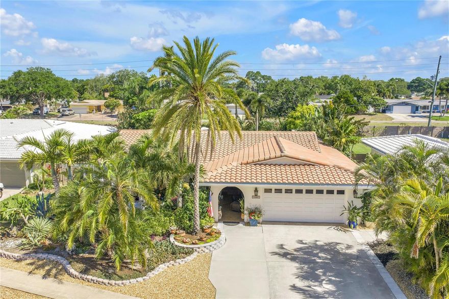 One or more photo(s) has been virtually staged. Welcome to one of Seminole’s most impressive fully upgraded 4-bedroom, 2-bath pool home, located in the highly sought-after Imperial Point community where lifestyle, quality, and location all come together. Situated on an oversized 12,000+ sq ft lot in Flood Zone X (non-evacuation), this home offers both peace of mind and a rare combination of space, upgrades, and true Florida living.
From the moment you step inside, the attention to detail is undeniable. The home features stone and porcelain flooring throughout, a thoughtfully designed layout, and high-end finishes that elevate every space. The chef’s kitchen is the centerpiece of the home, showcasing a Fulgor 48” dual fuel range, a 48” Zephyr Pro commercial-grade hood, a Fulgor stainless steel refrigerator, and a Sharp drawer-style microwave. A massive island topped with granite/quartzite countertops provides both function and style, complemented by a travertine farmhouse sink and custom cabinetry with premium storage solutions.
Just off the kitchen, the home flows seamlessly into a custom bar and entertaining area, complete with a built-in keg cooler, dedicated storage, and an ideal setup for hosting guests or enjoying everyday living. The open flow between indoor and outdoor spaces makes this home perfect for entertaining on any scale.
The upgrades continue throughout the property, including PGT hurricane impact windows and doors,  newer HVAC system in 2022, and numerous system updates that provide long-term value and efficiency. Built with solid masonry construction and topped with a concrete tile roof, this home also features a spacious two-car garage with over 500 square feet of space.
Step outside and you’ll find a private tropical retreat designed to impress. The pool area is surrounded by lush, mature landscaping and enhanced with water feature statues, trellis accents, and multiple outdoor living spaces that create both privacy and a resort-style atmosphere. The homeowners have thoughtfully created small walking paths along the perimeter of the backyard, leading to a gorgeous trellis where you can relax with a book and truly enjoy the peaceful setting. This backyard is not just functional—it’s an experience.
Imperial Point residents enjoy access to optional HOA amenities that truly set the community apart, including a waterfront clubhouse on the Intracoastal Waterway, a community pool, tennis courts, a fitness center, library, playground, yoga classes, and an active social calendar. Additional amenities such as a boat ramp and dock access create a true coastal lifestyle with something for everyone.
This exceptional home offers thoughtful upgrades, quality craftsmanship, and an outstanding lifestyle in one of Seminole’s most desirable neighborhoods, just minutes from the Gulf beaches, dining, and everything the area has to offer.
4-bedroom homes with this level of finish and outdoor living are extremely rare—schedule your private showing today.