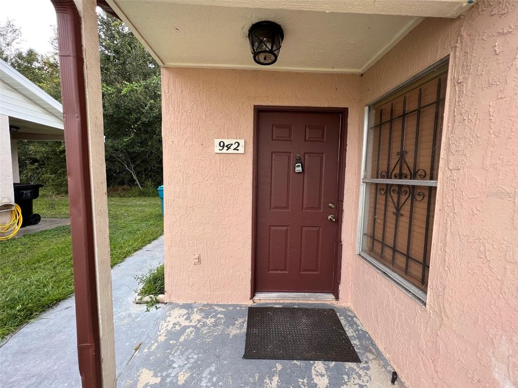 Photo of 942 Loquat Tree Road, Orlando, FL 32811 (MLS # O6398161)