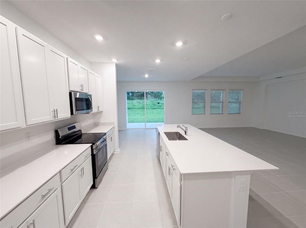 Photo of 669 Tundra Loop, Groveland, FL 34736 (MLS # O6433994)