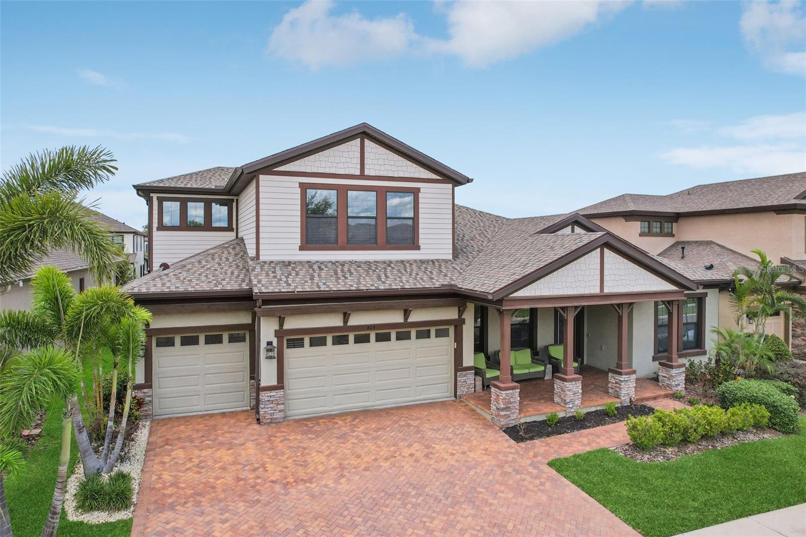 NOW IS THE TIME! PRICE JUST REDUCED ON THIS STUNNING HOME IN A SOUGHT-AFTER GATED COMMUNITY. ENJOY A PRIME LOCATION, PREMIUM STYLE, AND HIGH-END UPGRADES AND EXTERIOR ELEVATION - ALL AT AN INCREDIBLE PRICE FOR A HOME OF THIS SIZE & QUALITY. DONT WAIT- OPPORTUNITIES LIKE THIS ARE RARE! THIS IS YOUR CHANCE TO OWN AN EXCEPTIONAL PROPERTY YOU'LL ABSOLUTELY LOVE TO CALL HOME! This beautiful Craftsman Key Largo II, a stunning WestBay home is designed for comfort, practicality, and entertaining. Located in the sought-after gated community of La Collina, you'll enjoy relaxing at the resort style pool, clubouse, dog park (with fun agility obstacles) and playground. The inviting front porch sets the tone, perfect for sipping your favorite beverage and greeting neighbors. Step inside to a dramatic open plan with soaring 12-foot ceilings in the foyer, formal dining room, grand room, and chef’s kitchen, creating an airy and spacious feel. The fully upgraded kitchen is a showstopper, boasting a large island ideal for hosting guests, solid surface countertops, upgraded cabinets, a tiled backsplash, built-in oven, large gas cooktop with a stylish hood, and a spacious walk-in pantry. The open-plan family room and dining area flow seamlessly, overlooking the beautiful outdoor space. Downstairs, enjoy the 3-way split plan with three spacious bedrooms and two baths, along with a versatile and spacious bonus/flex room plus a private office space with double-door entry. The luxurious owner’s retreat features double-door entry, dual walk-in closets with California Closet organizers, and a spa-like en suite with a walk-in shower, garden tub, double vanity, and water closet. Upstairs, a large bonus room, private bedroom, and full bath create a perfect retreat for guests or family. The spacious lot is 70'x130' which offers ample back yard space is perfect for both playing and relaxing, featuring a large covered lanai, extended paver patio with a built-in firepit for cold weather fires and cooking smores. Additional highlights include a paver driveway and walkway, easy care wood-like tile planks, a well-lit three car garage with a sealed floor great for any projects you have, along with a tankless water heater, two HVAC systems with sanitizing UV lights, water conditioner, upgraded tile and listellos in every bath, and huge sliding doors for open, bright views. **There is even a great loan assumption opportunity at a low interest rate! Call for more details!** This home is move-in ready with a brand new roof in 2025, transferable home warranty good through March 2026 and a builder’s 2/10 warranty through March 2028. It has everything you could want, including one of the best locations in Brandon near restaurants, shopping, commuter routes, and beautiful Florida attractions and beaches. Don’t miss this opportunity for carefree, luxurious living! You'll want to put his home on your DEFINITELY MUST SEE LIST TODAY!!
