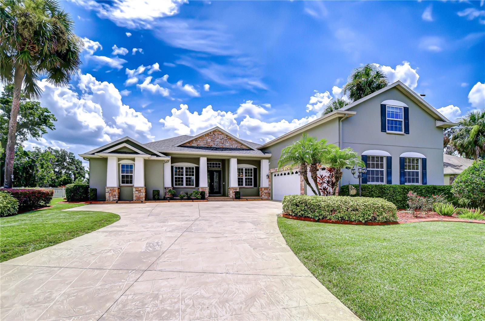Experience Florida living at its finest in this custom-built estate located in the exclusive, gated community of Darby Lake —a private enclave where every home is uniquely crafted and no two properties are alike. Perfectly positioned on a stunning half-acre lot with breathtaking pond and lake views. From the lush tropical landscaping to the stone-stamped driveway, the curb appeal is undeniable. The front porch makes a grand impression with large architectural columns, stacked stone accents, and a welcoming design that hints at the custom craftsmanship found throughout the home. Step inside to discover freshly painted interior spaces filled with natural light and thoughtful details at every turn. The formal living and dining rooms are ideal for entertaining, with serene water views as your backdrop. The remodeled kitchen (2018) features granite countertops, a custom backsplash, under-cabinet lighting, and a Closets by Design pantry. Newer appliances include a dishwasher (2021), microwave, stove, and refrigerator (2023). A dedicated hot water heater serves the kitchen sink and dishwasher. The bright breakfast nook offers tranquil views of the backyard, pond, and pool, while the adjacent family room includes built-in six-speaker surround sound (2018) and sliding glass doors that lead to your private outdoor retreat. Enjoy year-round outdoor living on the resurfaced pool with new gunite (2021), new concrete lanai, screen enclosure (2019), pool heater (2021), and fully fenced backyard (2022). The lanai is also pre-plumbed for an outdoor kitchen, offering endless potential to create your dream entertaining space. Stunning Nebula lighting installed in 2022 adds ambiance in the evenings and is easily controlled by app. The property also includes well irrigation, helping maintain the lush landscaping with efficiency and cost savings. This home was built with comfort and efficiency in mind, offering spray foam insulation (2013), an Aqua Pure water softener (2016), a whole-house generator (2018), and a whole-house central vacuum system for added convenience. Luxury vinyl plank flooring was installed throughout the first floor in 2018, and new Pella windows were added to the rear bonus room/bedroom in 2020. A new water heater was installed in 2023, and the roof was just replaced in February 2024. Designed for flexibility, the home features a dedicated office, multiple bonus spaces, and a spacious upstairs retreat with half bath and oversized storage — ideal as a fifth bedroom, media room, or guest suite. The primary suite is privately located on one side of the home and includes a sitting area with lanai access, a spa-like en-suite bath with soaking tub, walk-in shower, dual vanities, and a custom Closets by Design walk-in closet (2019). Two additional bedrooms on the opposite side of the home share a full bath, while a fourth bedroom or bonus room at the rear of the home offers its own full bath and peaceful water views. And with easy access to I-75, I-4, and the Crosstown Expressway, you’re just 5 minutes from major interstates and less than 20 minutes from Downtown Tampa, Brandon’s shopping and dining districts, and all that Central Florida has to offer. Zoned for excellent schools, including Strawberry Crest High School and its renowned International Baccalaureate Program, this home offers a rare combination of luxury, location, and lifestyle. Copy and paste this link to tour the home virtually:my.matterport.com/show/?m=5hLuSSb16ZL&mls=1