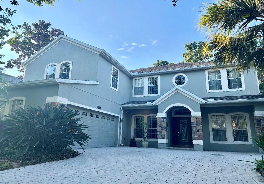 Welcome to this beautiful stunning two-story home located in exclusive area in Oviedo Forest community, quite neighborhood in a conservation area and a cul-de-Sac, offering 6 spacious bedrooms and 4 full bathrooms and 2 overside car garage. This thoughtfully designed home features a tons of living space, formal living room, dining room and large family room and a big kitchen is equipped with stainless steel appliances, two ovens, breakfast bar, 42’ cabinets with tile backsplash, granite countertops, ideal for both everyday cooking and entertaining; the large family room sits adjacent to the kitchen, providing an inviting space for gathering.  Upstairs you’ll find beautiful wood flooring, while the main living areas feature durable hard tiles, and cozy carpet enhances the bedrooms. The master bedroom located upstairs will be your own private retreat, the spacious owner’s suite with dramatic tray ceilings and crown molding and very unique custom lighting that envelops the entire room in a warm, relaxing glow. The owner’s suite features two walk-in closets for him and her that added convenience to the couple, a large window views the nature. The master bathroom has a separate toilet, two sinks and vanities, corner garden tub with two large windows at each side, in addition, the home includes a whole-house intercom system, adding convenience and connectivity throughout. The sixth bedroom can function as an in-law suite, media room, or flex space to suit your needs. The room is as large as the primary suite and includes its own full bathroom with shower and toilet with bidet, making it an ideal second owner’s suite or a perfect multi-generational living solution. The other bedrooms upstairs have a walk-in closet and a bathroom with two sinks. The first-floor bedroom offers an ideal setup for a guest room or private home office with a full bathroom with an imported Japanese toilet.
The home boasts two elegant French doors in the rear lanai, enhancing the indoor-outdoor living experience. Step outside to your private backyard oasis with no rear neighbors and lush conservation views. A vibrant fruit and vegetable garden is perfect for green thumbs and those seeking a sustainable lifestyle. The garden features calamansi, black-eyed peas, Barbados cherry, and a variety of fruit trees including papayas, star fruit, mangoes, avocados, bananas, lime, figs, as well as squash, sweet potatoes, and more. The home has sprinkle system to nourish the St Augustine grass. 
Additional highlights include a paved driveway in the entryway, a home warranty for added peace of mind, and proximity to grocery stores, churches, parks, a dog park, restaurants, Mall, medical center, easy access to SR-417 and zone for highly top-rated A+ Seminole County schools, close to UCF. This home is a rare blend of space, comfort, and privacy, this home truly has it all!
Schedule your showing appointment on this unique property today!