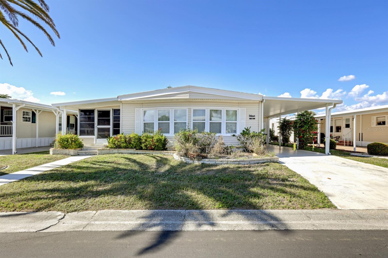 FANTASTIC PRICE REDUCTION!!!! Loads of space in this 2 bedroom/2 full bath 1979 manufactured home located in the award winning 55+ golfing community of Maple Leaf Golf & Country Club. Spacious home with a large living room and a large lanai so it's perfect for entertaining. The kitchen has a breakfast bar and feels more open so that everyone can socialize with the chef while delicious meals are being made. The large shed outside is complete with a rear double door in case you have a golf cart to store if you are seasonal. Located in the desirable X flood zone. Per the sellers the home has never flooded since it was brand new. Home prices include membership certificate. Sorry no dog allowed in this home, one indoor cat only. HOME BEING SOLD "AS IS" WITH RIGHT TO INSPECT. In Maple Leaf you'll enjoy an active social community with over 75+ clubs and activities, golf course, 4 pickleball courts, 5 tennis courts, 4 swimming pools, 2 shuffleboard court centers, mini golf, horseshoe pits, 2 hot tubs, clubhouses, 2 restaurants, tiki bar and the list just goes on and on. There's always something to do in Maple Leaf. If you want to hit the interstate and head out to other destinations for a day trip interstate 75 is just a short drive away. There's plenty of restaurants and shopping all within a short drive. If staying local is your thing head down Kings Highway to the Sunseeker resort for many types of dining or to Punta Gorda where downtown always has something to offer. It's all about the lifestyle in Maple Leaf!