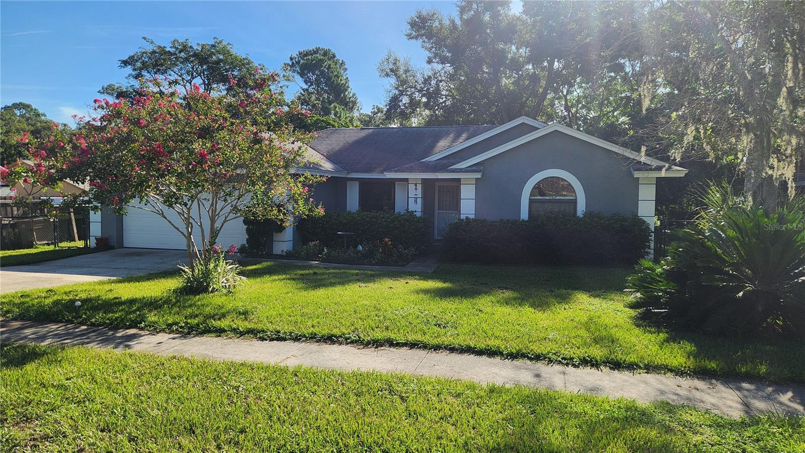 This is a home where comfort meets style in the heart of Clermont! This beautiful 4-bedroom, 2-bath home in the desirable Greater Hills community offers the perfect blend of comfort and functionality. Step inside to an open floor plan that flows effortlessly from the spacious living area to the separate dining room and bright eat-in kitchen, complete with ample cabinet space and a breakfast bar. The formal living room provides a versatile space that can be the perfect spot for a home office, craft room, or a playroom. Relax or entertain year round in the screened back porch overlooking your private backyard with no rear neighbors.
In Greater Hills, you’ll enjoy a lifestyle as appealing as your home, swim in the sparkling community pool, play a friendly match on the tennis courts, or take the kids to the tot lot. This home is just minutes from shopping, dining, and major highways, making your commute a breeze.