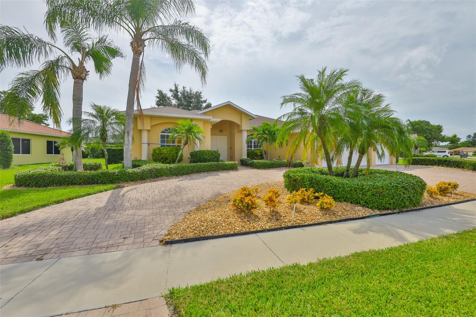 Your Dream Pool Home Awaits! Welcome to this stunning Executive style, move-in-ready Heated Saltwater POOL & SPA home featuring 4 bedrooms, 3 bathrooms, and a spacious 3-car garage in the desirable La Paloma community. From the moment you step through the double front doors, you’ll fall in love with the open, light-filled floor plan that’s perfect for entertaining and family living. The spacious living room boasts soaring ceilings and sliding glass doors that flood the home with natural light. The dining area offers a wonderful setting for both formal dinners and casual meals with family and friends. At the heart of the home is the UPGRADED chef’s kitchen, featuring QUARTZITE counters w/WATERFALL edge, new STAINLESS steel appliances, a large center island, breakfast bar, and TWO pantries for all your storage needs. Overlooking the breakfast nook and family room, this kitchen seamlessly blends function and style — perfect for gatherings or cozy evenings at home. Retreat to the luxurious master suite with sliders leading to the pool, TWO walk-in closets, and a completely UPGRADED spa-like bathroom featuring Shaker-style Vanities with soft-close drawers, Quartzite counters, black granite sinks, BACKLIT mirrors, and a seamless glass walk-in shower. The split-bedroom layout ensures privacy, offering THREE additional bedrooms and two UPGRADED bathrooms — perfect for family, guests, or a home office. Throughout the home, you’ll find tile flooring, newer carpet, and luxury vinyl plank flooring, along with upgraded PLANTATION shutters adding elegance to every room. Step outside and enjoy your PRIVATE outdoor oasis! The expansive screened lanai invites you to relax poolside, soak in the heated spa, or simply enjoy the Florida sunshine without pesky bugs. Additional highlights include a newer roof (2020), HVAC (2016), Water Heater (2020) NO CDD fees, and a low HOA. Ideally located, La Paloma offers quick access to I-75, making trips to Tampa, St. Petersburg, Sarasota, dining, beaches, and entertainment a breeze. This home has it all — luxury, comfort, and the ultimate Florida lifestyle. Don’t wait — schedule your private showing today!