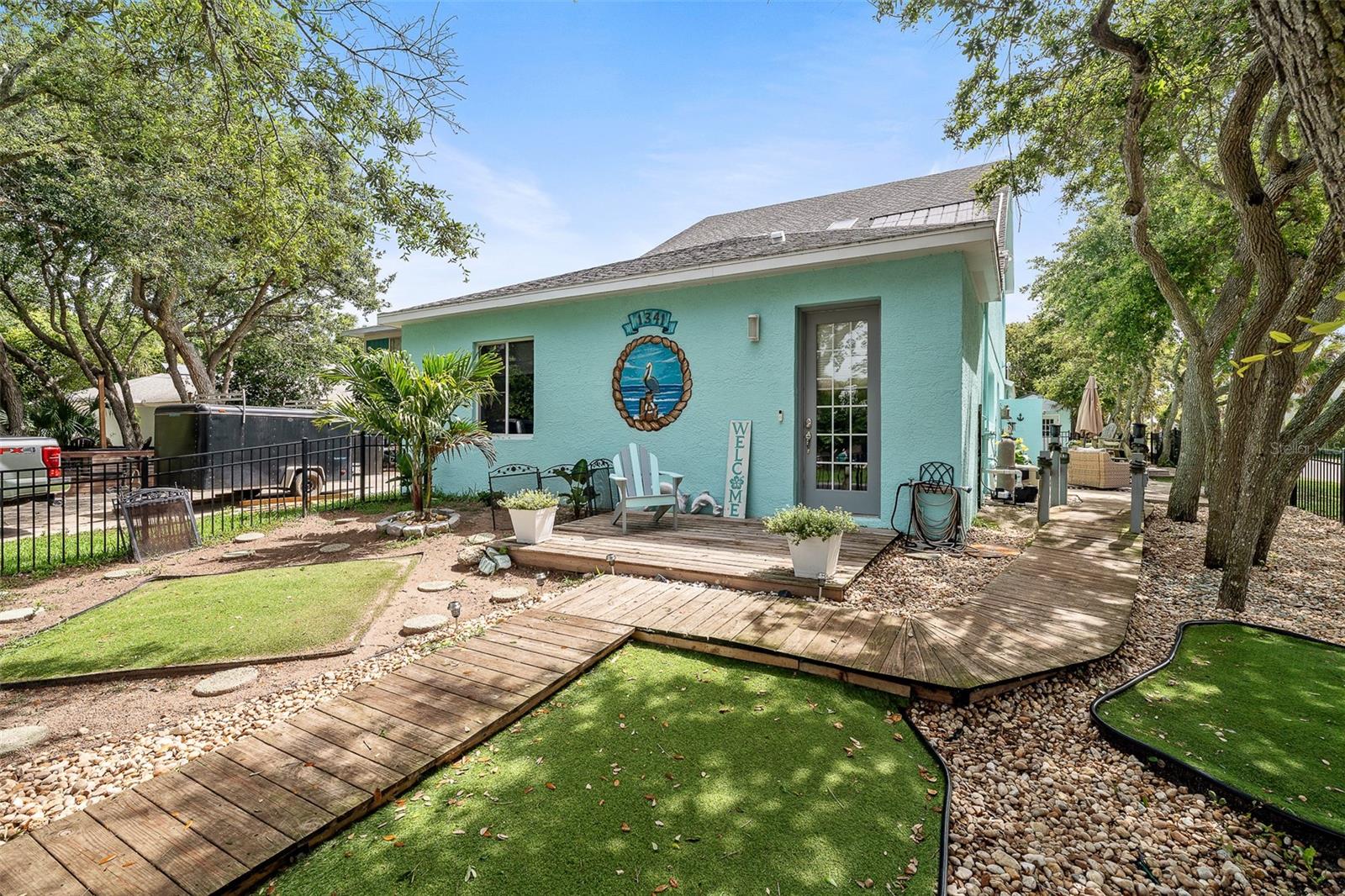 Coastal living just two blocks from the beach! Welcome to 1341 S Daytona Ave – a rare and versatile coastal retreat in the heart of charming Flagler Beach! This spacious 3-bedroom, 3.5-bathroom home sits on a corner lot just two short blocks from the Atlantic Ocean and offers an unbeatable blend of comfort, functionality, and rental potential in a non-hazardous Flood Zone X. Step inside to discover a unique layout featuring a heated indoor pool, perfect for year-round enjoyment and entertaining in any weather. The home includes a flexible private wing that can function as a 1-bedroom apartment with its own entrance—ideal for rental income, in-law suite, or guest accommodations. Outdoors, the property is a private oasis beneath a canopy of mature coastal oaks, offering shaded sitting areas, beautiful landscaping, and a large storage shed for all your gear, tools, or beach toys. Flagler Beach is one of Florida’s last authentic beach towns—laid-back, golf-cart friendly, and full of local charm. From weekly farmers markets and live music to surfing, fishing, and waterfront dining, the community vibe is welcoming and vibrant. Whether you’re looking for a full-time residence, vacation home, or income-producing property, 1341 S Daytona Ave delivers the best of beachside living in one of Northeast Florida’s most desirable coastal communities.