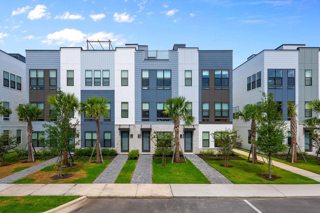 Welcome to The Brix at The Packing District! Located near downtown Orlando and College Park. Now, let's talk about this luxurious 4-story townhome available for rent. With 2 bedrooms, 2 full bathrooms, and 2 half bathrooms, this townhome offers plenty of space for comfortable living. The highlight of this home is the rooftop terrace, where you can relax and enjoy the beautiful surroundings. As you enter, you'll be greeted by a welcoming foyer leading to flex room space with half bath. On the second floor, the kitchen boasts KitchenAid gourmet appliances, a spacious center island with a breakfast bar, ample counter and cabinet space, and a roomy pantry. The third floor features a splendid primary bedroom suites with same floor laundry room your convenience. On the fourth floor is where your roof top terrance with a water view. Community features a dog park and a beautiful mew area with a park-like setting, complete with gathering and seating areas. Plus, you'll be close to a variety of upcoming amenities, including the Orlando Tennis Centre, YMCA Family Center, bike lanes leading to College Park, a food hall and beer garden, a regional park with stunning pond overlooks, an urban farm, sports fields, a pavilion, an entertainment stage, and scenic walking and jogging trails. This location grants you easy access to top-rated schools, colleges, and universities, as well as fantastic shopping, dining, arts, and recreational options in College Park, downtown Orlando, and Winter Park. Major highways like State Road 408 and I-4 provide seamless connections to the region's renowned attractions and entertainment. Rent includes internet.