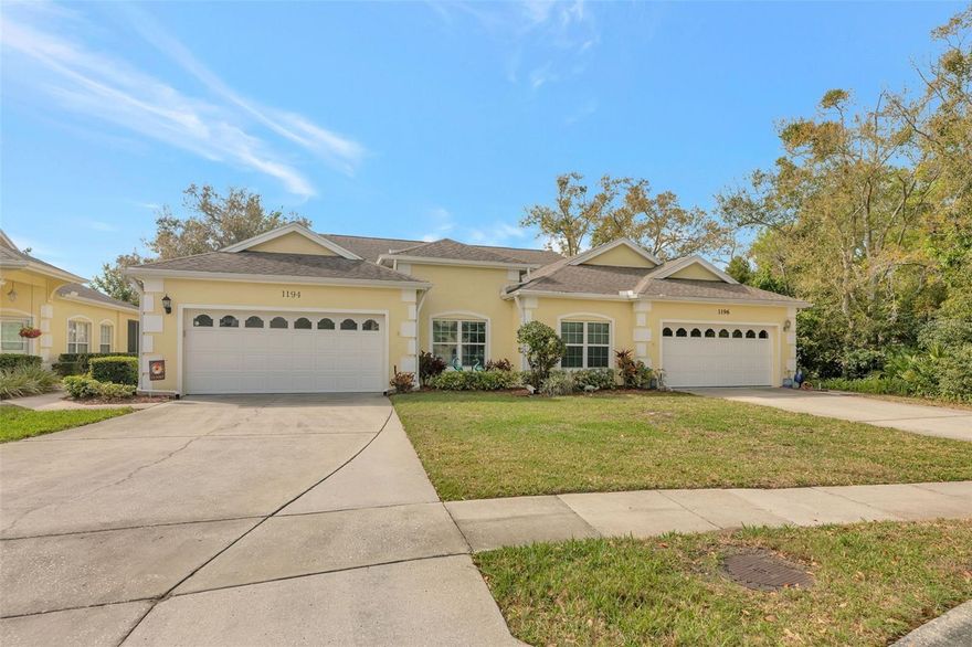 Rarely available updated VILLA with a two-car garage in the gated Queen Anne Gate community of Palm Harbor! This all-ages, pet-friendly neighborhood offers maintenance-free living with a low $320/month HOA fee and is ideally located at the end of a quiet cul-de-sac.
Inside, you’ll find soaring 10’–15’ volume ceilings creating a bright, open feel. The great room and primary bedroom feature real hardwood flooring, while the kitchen offers modern tile flooring, granite countertops, updated backsplash, sink, and fixtures. A spacious breakfast nook provides additional space for dining, a desk, or extra pantry storage.
The large primary suite includes fresh paint, a walk-in closet, soaking tub, updated shower with rain shower head, and a private water closet. The split floor plan offers privacy, with the second bedroom located at the front of the home. A third bedroom or bonus room with double-door entry and built-ins makes a perfect office, den, or media room. Skylights add extra natural light and architectural interest, and all windows have been upgraded.
Enjoy the enclosed Florida Room featuring high-impact windows and doors, automatic shades, and a separate A/C unit—perfect for relaxing while overlooking the nature area and outdoor patio. Roof is only 9 years old.
Community amenities include a pool, trash service, cable TV, lawn and shrub maintenance, and irrigation. A wonderful place to call home in a friendly, well-maintained community!
UPGRADES INCLUDE: Split-unit A/C added to the lanai increasing usable square footage; plantation shutters in living room; blackout roller shades in master and guest bedrooms; Closets by Design systems in master and guest bedrooms; two new master closet doors; updated refrigerator, stove, and microwave; new master toilet; ceiling fans in all rooms; remote shades on lanai; freshly painted interior; washer and dryer relocated to kitchen as original floorplan including new barn-style doors added; den pocket door tracks replaced and doors realigned; water softener; professionally finished garage floor and added garage shelving; added master bedroom vent and new wider A/C ducts.