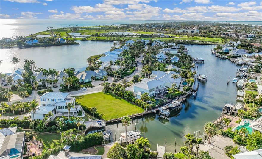 Located within the exclusive, gated community of Boca Grande Isles, this expansive western-facing waterfront homesite presents an unparalleled opportunity to create your coastal dream retreat. The property boasts 96 feet of direct water frontage on approximately 0.30 acres and offers seamless access to the Intracoastal Waterway and the Gulf without obstructing bridges. Conceptual house plans designed by the renowned architectural firm, Stofft Cooney, are available for both a one-story and two-story design, along with a current survey and a comprehensive site study to inspire your vision. Essential utilities, including electricity, sewer, and water, are in place, and the property has undergone extensive site preparation to ensure a smooth building process. A concrete seawall and a picturesque wooden dock provide immediate water access, while recent landscaping enhances privacy and natural beauty. Just moments from Boca Grande’s historic village, pristine beaches, and renowned boating community, this exceptional homesite is the perfect setting for an elegant island retreat. The listing agent is the owner.