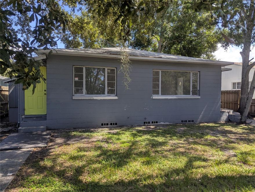 An investor's or renovator's dream! This 2-bedroom, 1-bath home is a blank slate brimming with potential, positioned directly across from Lake Maggiore Park. Freshly painted and featuring a 1-car garage, workshop, and versatile bonus room, the property is ready for a complete kitchen renovation. The large, fully fenced backyard, complete with a rolling gate, serves as a private retreat for relaxation, pets, or weekend gatherings. With "good bones" and endless possibilities, this can be your perfect home. Conveniently located across from Lake Maggiore Park, with fishing, boating, and family gatherings. Minutes from downtown St. Pete, I-275, Gulf Beaches, Restaurant.