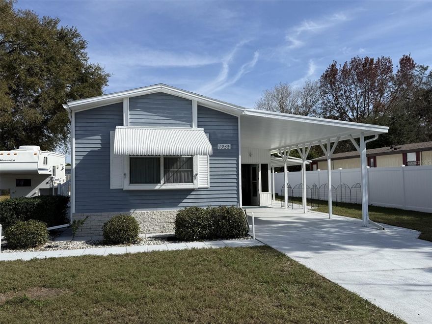 Beautiful well maintained home in Lake Mariana Acres.  This water access community offers a clubhouse for entertaining, games, and parties.  There is a shuffle board area, dock for fishing and a community boat ramp.  This home is super clean with lots of extra space.  The entire home is surrounded with pavers, there are two sheds, 12X10 that can fit a golf cart and a 8x8 used as a workshop.  There is an exterior covered area with a privacy fence on that side of the home.  Walk into the enclosed lania area 15x20 with newer windows and screens, this offers the ability to have fresh air or allow for the cool air from inside the home to come into the lania. To the back of the lania is a large storage area that includes storage shelving. This home offers a split floorplan with each side having a bedroom and bathroom for maximum privacy.  The family room kitchen combo has an eat in space along with a build in desk area.  This is a well taking care of home, you will not be dissappointed!