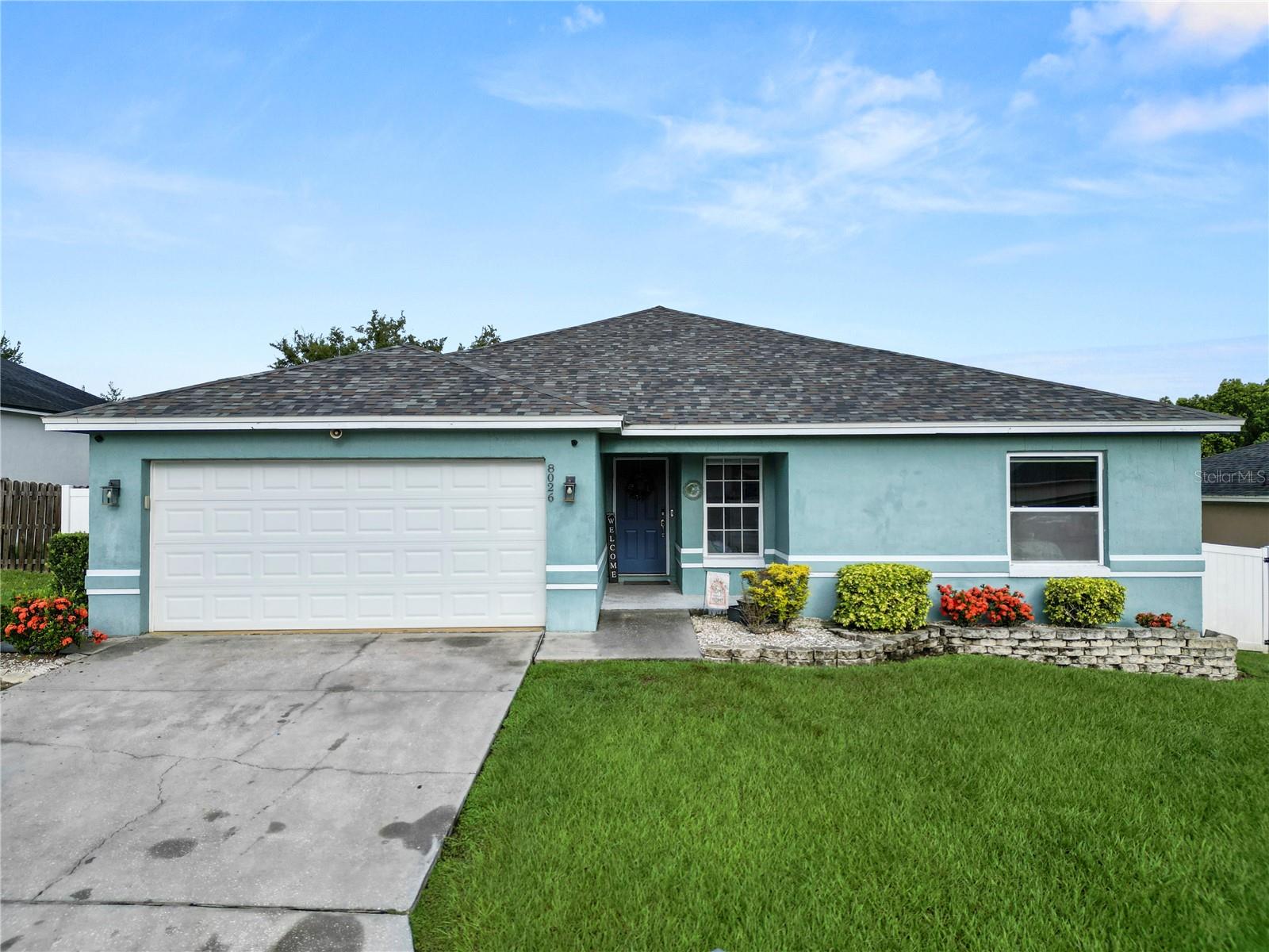 This stunning 4-bedroom, 2.5-bathroom split-bedroom pool home seamlessly blends comfort, style, and functionality. The roof was replaced in 2019, along with new flooring throughout, new kitchen remodel including cabinets, countertops and new appliances. In 2021, the outside AC unit was replaced along with new Behr exterior paint. Designed with both entertaining and everyday living in mind, this home offers spacious open-concept living areas, abundant natural light, and thoughtful upgrades throughout. The split-bedroom floor plan ensures privacy, with the primary suite tucked away from the guest rooms. The luxurious primary retreat features a mini split AC unit to keep it extra cold, spa-like en suite bath with a jacuzzi tub, tiled stand up shower with rain fall shower head, 2 walk-in closets, dual sink vanity and a private water closet. The heart of the home is the gourmet kitchen, equipped with stainless steel appliances, quartz countertops, and a water softener with filter on the kitchen sink, along with a breakfast bar for quick morning meals. You'll also find the dining area just off the kitchen. Just steps away, the open family room with vaulted ceilings flows effortlessly to the outdoor living space. There is an enclosed all seasons room just off the living room leading to your stunning outdoor space. Step outside to your personal resort-style backyard, where a sparkling salt water pool with a beach entry and waterfall invites relaxation and fun. The pool was installed in 2019. The custom outdoor kitchen — complete with built-in grill, sink, and prep space — makes alfresco dining a breeze. You'll also find a gas stove and built in mini fridge. The side yard features a turf yard and provides access to the half pool bath. Additionally, the property features a large privacy fenced backyard with storage shed that conveys. Additional features include a dedicated laundry room, generous storage, and a 2 car garage with faux marble painted floor. Whether hosting guests or enjoying quiet evenings at home, this property offers the ideal blend of indoor-outdoor living.