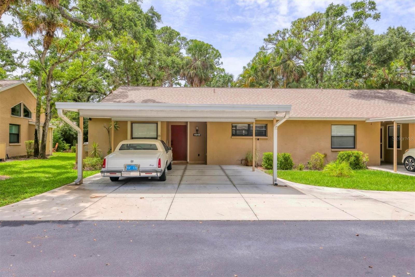 Annual unfurnished updated rental in popular Village Gardens! One of the largest floor plans in the community, the Palm, with a finished lanai for additional living space. Two bedrooms, two baths, both baths are updated with glass bowl sinks and feature full-body shower panels. You will love the spacious kitchen, featuring a gas range, stainless appliances, beautiful granite countertops and solid wood cabinetry with soft-close drawers. There are ceiling fans throughout, travertine flooring in the guest bedroom and living areas, and carpet in the primary bedroom. You will love the separate laundry area with newer LG washer and dryer, and a mop sink. The vaulted ceiling in the living area makes it feel much larger. There is plenty of hot water as this villa has a tankless hot water system. Out front, there are two covered parking spots, and the community offers a heated pool, tennis and shuffleboard, as well as a grilling area, and is lushly landscaped to give you the old Florida feel. Just minutes from SRQ Airport and downtown Sarasota, our beautiful beaches are just minutes away too.