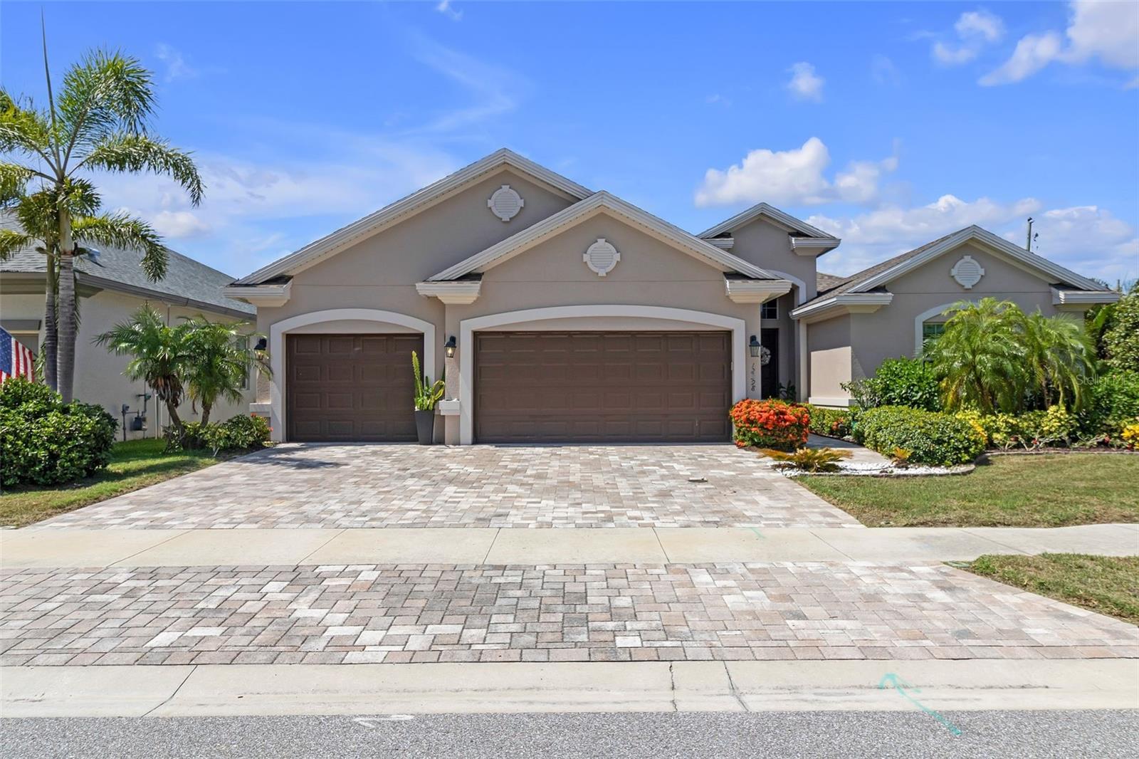 This well-maintained NEWER BUILD (2018) home in gated community has it all! Situated on a large, fenced corner lot in a NO FLOOD ZONE area, it is truly a gem. This block home is still under the10-year builder warranty and includes hurricane shutters system, in wall pest control system and noise canceling insulation all throughout the house. As you enter, you’ll feel the size of the living/kitchen space and will love the eating nook in the kitchen overlooking the pool area. Main areas have natural hardwood flooring, with waterproof laminate in the bedrooms. Tray ceilings in living and Primary Bedroom. Your new home has custom high end chandeliers, custom closets, including spacious pantry and garage cabinets. Kitchen includes upgraded cabinets, dual ovens, wine fridge and custom spacious pantry. Other home updates include crown molding, custom closets in all rooms, and a beautiful built in outdoor kitchen with brand new direct line gas grill, side burner, refrigerator, sink and stainless-steel drawers. House has oversized three car garage, oversized enclosed paved outdoor area with an extra-large heated saltwater pool and jacuzzi. Back yard is fenced in and has privacy palm trees around entire lot. Updated Sprinkler system with a weather sensor. Gas cooktop and gas tankless water heater. Primary bedroom has a private exit to the pool and two separate spacious custom closets. Primary bath features an oversized spacious shower, garden tub and separated sinks. All high-quality bathroom fixtures were updated in 2020. This model also includes a large utility room and an additional storage room that is currently used as another spacious closet but can be turned into an office. This cozy gated community of only 16 homes includes a private entry to Pinellas Trail to enjoy outdoor trails and bike rides. Close to beaches and major attractions. This home will not need repairs or upgrades, so you can focus on enjoying your Florida style living!