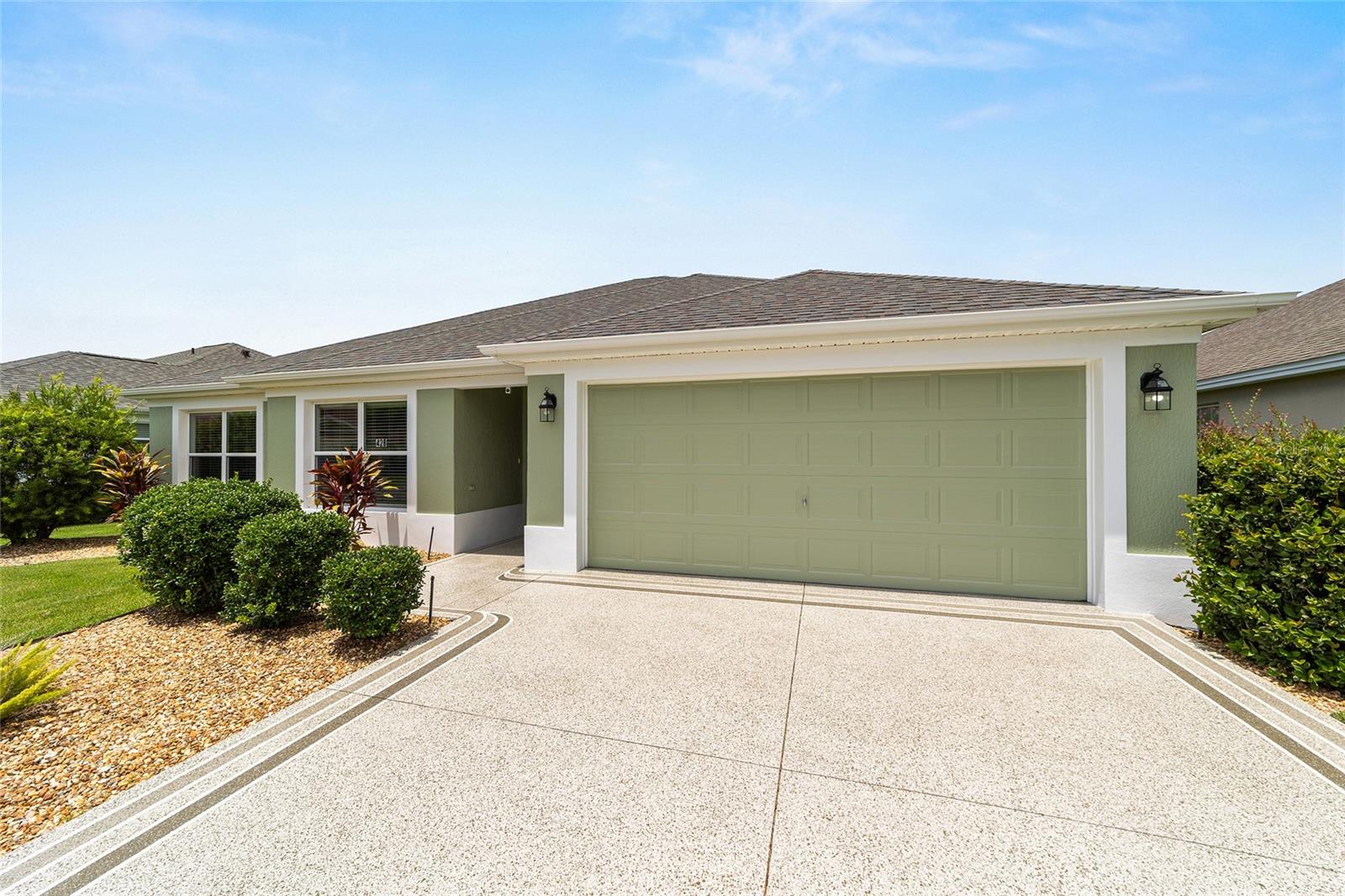 This well-maintained Cedar model offers 1,827 sq ft of open concept, located in the highly desirable Village of LaBelle North. This move-in-ready home features porcelain TILE flooring throughout, crown molding, fresh interior and exterior paint, and a thoughtfully designed layout perfect for everyday living and entertaining. The updated kitchen features QUARTZ countertops, modern lighting, a charming breakfast nook, a breakfast bar, SS appliances, and plenty of cabinetry. Solar tubes provide an abundance of natural light throughout the living area. The primary suite boasts a tray ceiling, customized closet shelving, and an en-suite with dual sinks, QUARTZ countertops, ample cabinets, a tiled walk-in ROMAN shower, and a private water closet. The guest bedrooms and bathroom are at the front of the home; both have closets, and one features a pocket door, creating a great guest area. The guest bathroom features a tub/shower combo, QUARTZ countertops, extra cabinets, and a window for natural light. Additional features include upgraded lighting fixtures, an indoor laundry room with a sink, a freshly epoxy-coated garage floor, a newly painted driveway, a TURN-KEY package available separately, excellent curb appeal, and a private screened lanai surrounded by lush shrubs for natural privacy. All upgrades have been made within the last year. Located just down the street from Colony Plaza, Belle Glade CC, LaBelle family pool, Captiva, Burnsed, & Rohan Rec centers, pickleball courts, bocce, shuffleboard, billiards, card rooms, and much more! Situated between Brownwood Paddock Square and Lake Sumter Town Square, offering easy access to Colony Plaza for shopping and dining. Call me today for your private tour!