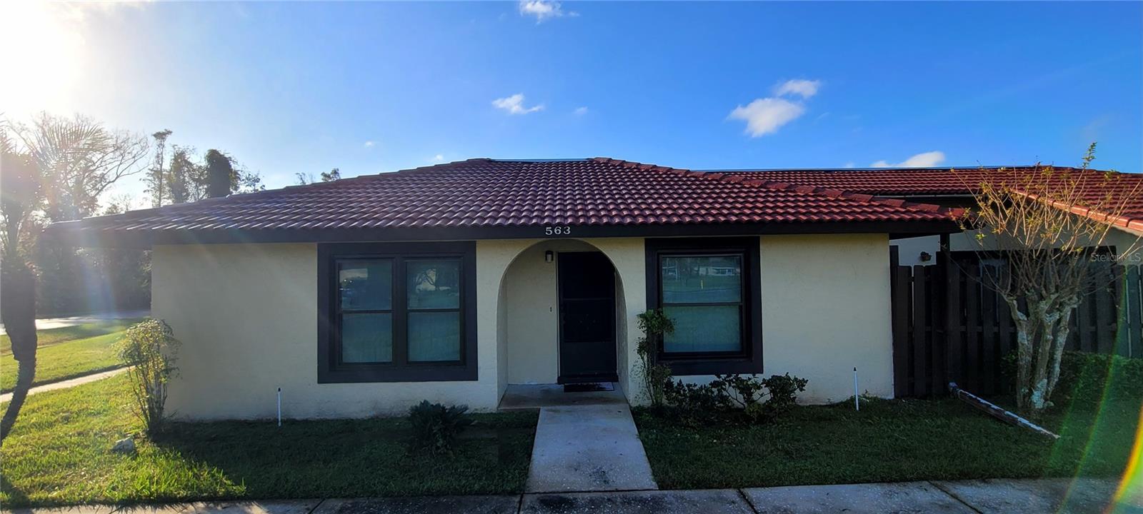 Come and see this beautiful 2 bedrooms 2 baths townhouse located in South Kissimmee. Great for investors or 1st time buyers. New Windows, New Roof, New Vanities, and New Toilets. Once you step inside you are immediately greeted by an open concept bathed in natural light. A sliding glass door leads to the private outdoor patio, perfect for a morning coffee. This end unit townhouse also includes a full-size interior laundry room with hookups & shelving. Located in a quiet well-maintained community that offers a swimming pool, tennis courts, and beautifully landscaped grounds. The HOA covers exterior maintenance and common areas. This property is perfectly situated just 30 minutes from Disney and within 2 miles or key amenities including restaurants, shopping centers, hospitals, and the post office. What are you waiting for! Call today for an appointment.