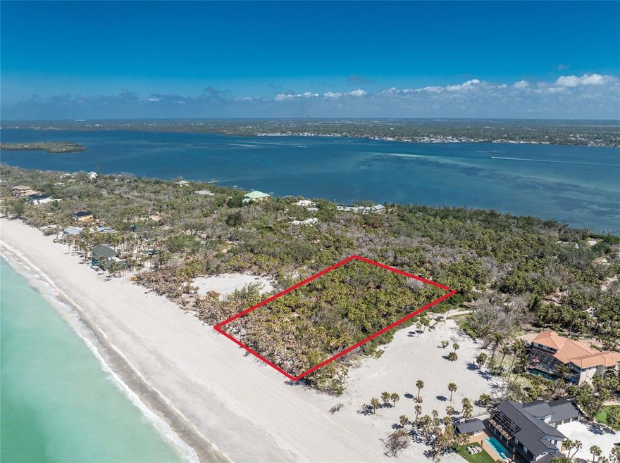 Make your dreams of coastal living a reality with this exceptional 2.3-acre Gulf-front lot on Manasota Key, offering 200 feet of private beachfront on the sparkling Gulf of Mexico. Priced at $4.9 million, this rare property is situated in an exclusive enclave of luxury single-family homes, with no commercial properties or high-rises to disrupt its peaceful setting. Imagine building your dream home here, where you’ll be surrounded by tropical beauty and unspoiled nature, with miles of beach to explore and the opportunity to witness dolphins, manatees, nesting sea turtles, and abundant sea life right outside your door. The sand on Manasota Key is naturally soft underfoot and rich with unique shells and fossilized shark teeth, making beachcombing a true adventure. The waters showcase incredible shades of turquoise, perfect for swimming, fishing, kayaking, and boating, with excellent access to nearby intracoastal waterways and the Gulf for world-class boating and fishing. Manasota Key, a barrier island in Sarasota County, offers Old Florida charm with a peaceful two-lane road shaded by a canopy of trees, free from traffic lights and away from crowded tourist spots, creating a truly serene atmosphere. Located just 50 minutes south of Sarasota, 90 minutes from Tampa or Fort Myers airports, and 50 minutes from Punta Gorda Airport, this exceptional Gulf-front property delivers the best of Florida’s coastal lifestyle and will not last long — contact us today to make it yours.
Are you interested in Gulf to Bay Front property?  Take a look at the lot across the street on a seperate listing D6142805.  Have the best of both worlds with Beach and Boating!