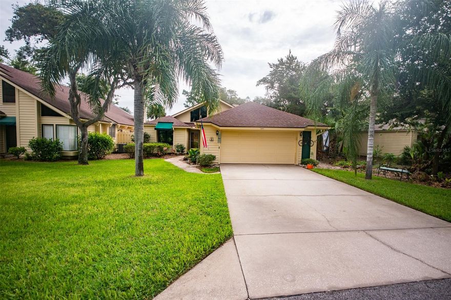 Come see this amazing home overlooking the championship golf course. This 3-bedroom 2-bathroom home is perfect for entertaining. Come walk into the vaulted ceiling home with large living room, natural gas fireplace and large family room overlooking the beautiful backyard and golf course. The master bedroom overlooks the yard and has a very large wrap around walk-in closet. The master bathroom with large shower, tub and makeup area makes it perfect. The second bedroom is currently being used as an office and has a built-in desk with upper cabinets and lots of storage. The third bedroom has built in storage and a sitting area under the window. The large open kitchen and 2 dining spaces are perfect for family dinners and entertaining. The large 2-car garage with built in cabinets, give plenty of space for storage. Both HVAC units were replaced in 2019. The owners have purchased new light gray laminate flooring for the master bedroom, closet, and bath. This will be installed as soon as it's available, installation is included. 
The St. Andrews HOA covers exterior paint for the homes every 7 years, yard maintenance with mulching twice a year, private community pool and maintenance of common grounds and private roads. Sugar Mill HOA has 24/7 security and maintenance of common areas. Sugar Mill CC membership offers a 27-hole championship golf course, clay tennis courts & pickleball courts, pool, fitness building and excellent dining. All information recorded in the MLS is intended to be accurate but not guaranteed ;Water: City