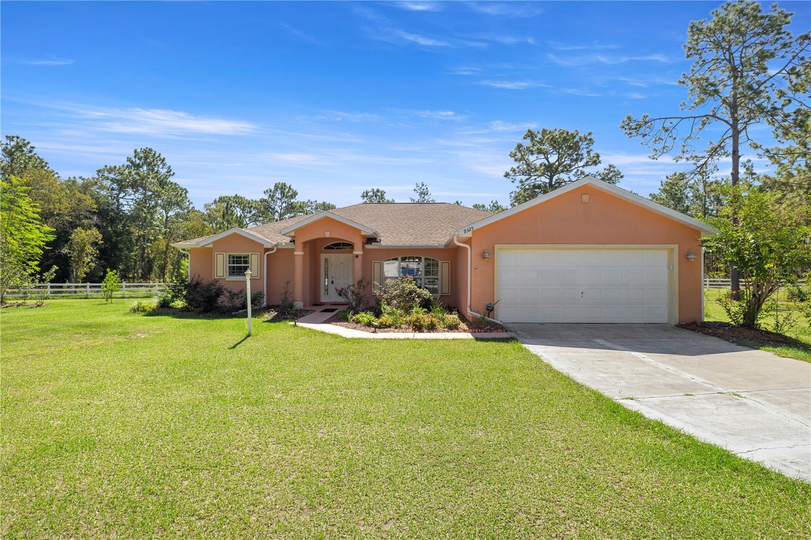 Experience sustainable living and natural beauty in the peaceful Rolling Hills community! This 3-bedroom, 2-bathroom home, built in 2006, offers 1,923 sq. ft. of thoughtfully designed living space on a lush, garden-inspired homesite. A photovoltaic solar system with 10KW battery backup, a high-efficiency 4-ton Carrier HVAC, and an architectural shingle roof ensure comfort, reliability, and long-term savings.
Step inside to find tile flooring throughout, spacious open living areas, and a serene primary suite with lanai access. The updated owner’s bath offers spa-like relaxation with a walk-in shower featuring new tile, dual vanities, a soaking tub, and two private walk-in closets. Modern conveniences include a water softener system, Spectrum Fiberoptic internet, and a security gate with dual remote access.
Outdoors is a paradise of its own with fruit trees, herbs, flowering vines, and a dedicated chicken run—perfect for fresh eggs and country living. With a private well, septic system, and no HOA, this home offers the freedom to live the lifestyle you’ve always wanted. Don’t miss the chance to make this exceptional Rolling Hills property your own—schedule a private showing today!