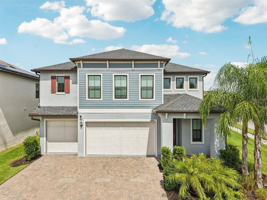 Welcome to your dream home in Bryant Square Estates!

Step inside this 2022-built beauty and feel right at home. Perched on a premium lot (the largest lot in Bryant Square) with peaceful lake views, this home features an upgraded screened-in lanai — the perfect spot for morning coffee or evening unwinding. The fully fenced backyard is spacious enough for a future pool while still offering plenty of room for gardening, play, or entertaining.

Location is a true highlight. You’re within walking or golf-cart distance to restaurants, grocery stores, multiple fitness centers, and local shops. The neighborhood even has a dedicated walking path to the middle and high schools — such a rare convenience. Bryant Square also offers two resort-style pools, a playground, food-truck nights, and seasonal community events that make it easy to connect with neighbors.

Inside, the foyer greets you with soaring ceilings, tile flooring on the main level, soft carpet upstairs, and crown molding for added charm. The kitchen is a showstopper with custom two-tone cabinetry, a massive island with seating for four, quartz countertops, a new GE Café dishwasher, GE combination washer/dryer, a new LG refrigerator, and more cabinet space than you’ll know what to do with. A new whole-house water softener has been installed for your convenience, as well. Tucked between the kitchen and garage, you’ll also find a handy coffee/mail nook and a huge walk-in pantry.

The living room flows seamlessly from the kitchen and features a custom entertainment center with fireplace, built-in cabinets, and a mantel that makes the space warm and inviting. Off the kitchen sits a guest bedroom with a full bath and walk-in closet — an ideal retreat for overnight visitors. A convenient half bath rounds out the first floor.

Head upstairs and you’ll find a generous loft — perfect for movie nights, game days, or simply relaxing. This level also includes the laundry room, the primary suite, and three additional bedrooms, each with access to their own bath. The primary suite is truly special with space for a sitting area, office, or workout corner. Its spa-like bathroom includes a glass shower, soaking tub, dual sinks, a private water closet, and large windows overlooking the lake. The walk-in closet is smartly placed just beyond the bathroom for extra privacy. Two upstairs bedrooms even feature their own en suite baths with double closets, making this a home where everyone has their own retreat.

Practicality meets peace of mind with a three-car garage, wide driveway, and hurricane-impact resistant windows.

Living in Bryant Square means being right in the heart of Trinity — with easy drives to Orlando, Tampa, St. Pete, airports, and award-winning beaches. This isn’t just a house; it’s a lifestyle where convenience, community, and comfort come together beautifully.