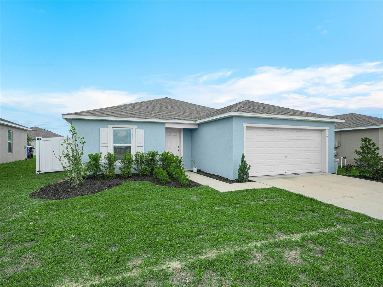 Comfort and convenience await you in this nearly new 4 bedroom, 2 bath home with fenced in yard. The kitchen is well appointed and the living and dining areas are open for entertaining. Alford Oaks is conveniently located in Haines City with easy access to Hwy 27, Davenport, and Poinciana, and is a short two minute drive from a brand new Publix shopping center. Ask about how the solar panels benefit YOU, practically eliminating the electric bill. Solar credits are included - simply pay the $35 monthly fee to the electric company and any overage you may incur. Lawn care is also included, so you can relax and enjoy your private backyard. Alford Oaks is a quiet and walkable neighborhood and this home is across the street from the community playground. Call for your showing!