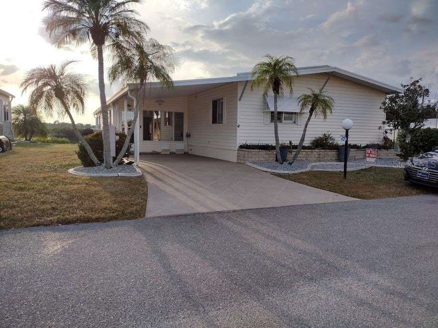 Waterfront property with a newer seawall located on the Myakka River in the premier 55+ community of Lazy River Village. About 1500 sq ft manufactured home with spectacular sunset views. It includes two bedrooms, two baths, living room, dining area. Updated kitchen with with view of the river from the kitchen. Walk in closets. Private boat dock. Enjoy resort living with many activities and clubs. Fully equipped wood shop, along with a community pool, tennis and pickleball courts, fitness center and other amenities. Community clubhouse with entertainment and many social activities and dinners. Monthly dues include internet and cable TV, weekly garbage pickup, lawn cutting, upkeep of all amenities, pool, hot tub, fitness center, clubhouse, etc. Community is a CO-OP and there is no lot rent. Each owner owns one share of the CO-OP which is directed by a board of 7 elected board members elected by the owners. This house is located in a section of the community with pet restrictions in accordance with community guidelines. Lazy River active living at its finest.
