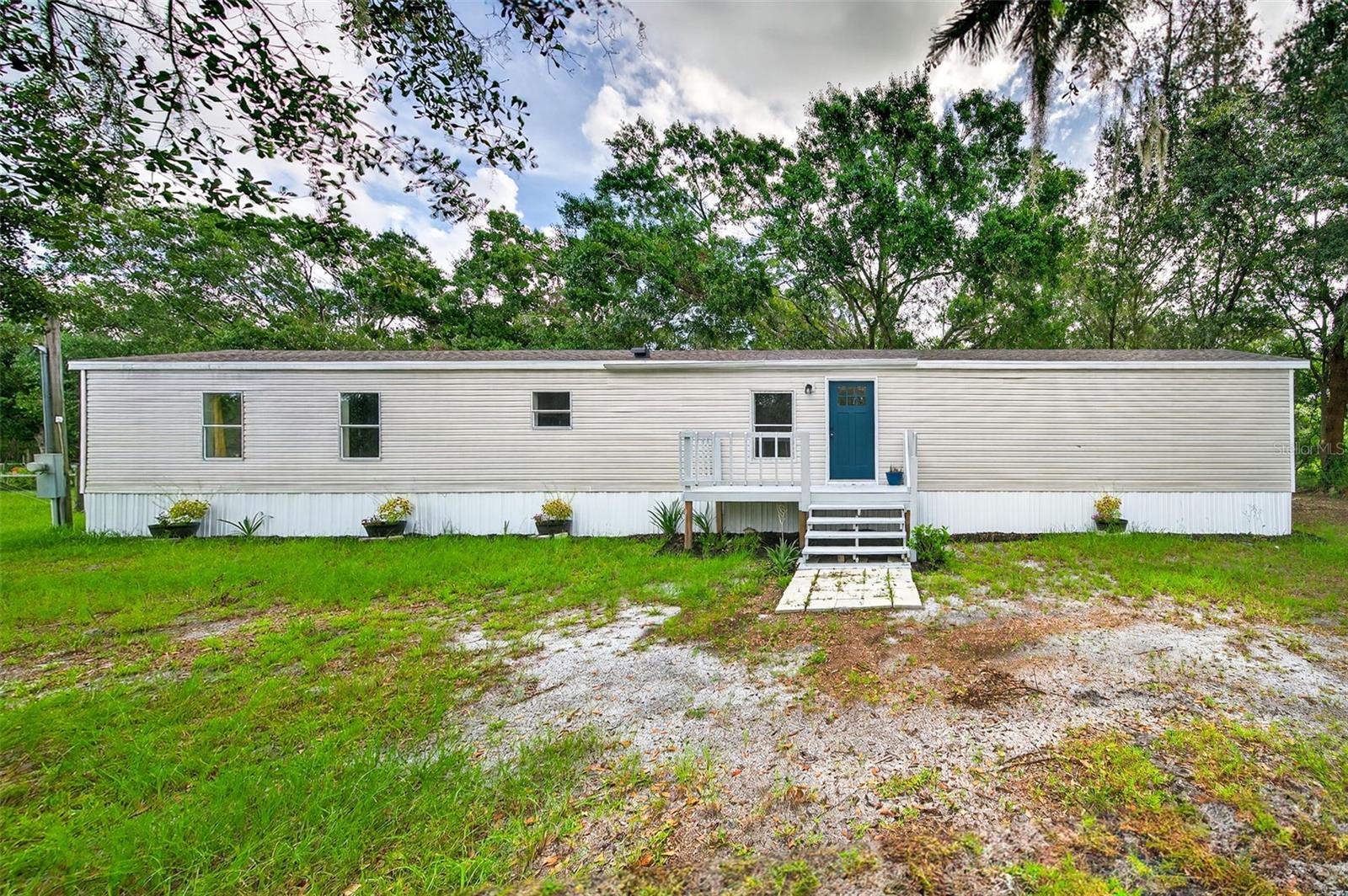 Escape to peaceful country living with this beautifully updated home nestled on over 3 acres of scenic Polk County land. Recently upgraded with a brand-new roof, new air conditioning system, and a fully renovated interior, this home is truly move-in ready. Inside, you’ll find updated bathrooms, new vinyl flooring throughout, and a stunning kitchen featuring granite countertops, sleek new cabinets, and stainless steel appliances. Ceiling fans in every room provide added comfort, while the large refinished back balcony offers the perfect spot to relax or entertain with views of your expansive property. A detached shed provides versatile space for storage, a workshop, home office, or even a private retreat. Combining modern upgrades with the serenity of rural living, this property is the ideal place to call home. Don’t miss your chance to make it yours!