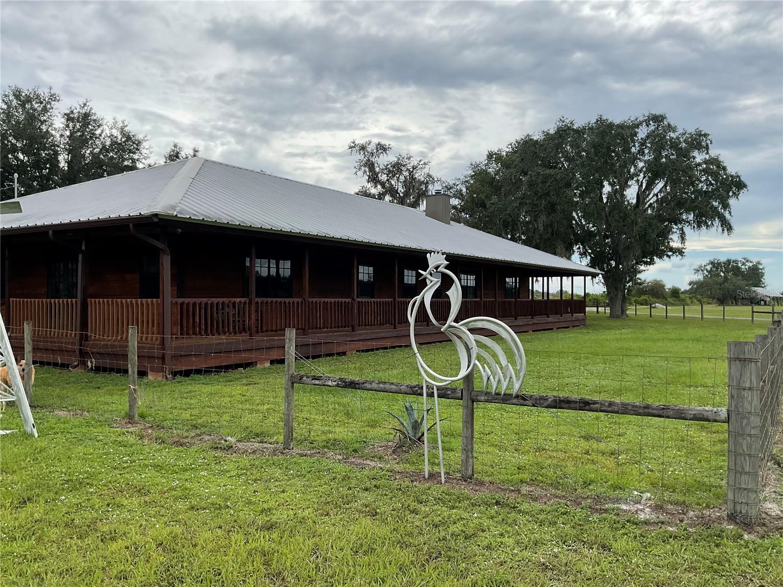 Back on the market due to buyers financing fell through!
Once-in-a-Lifetime Opportunity to Own 97 Acres of Privacy in Myakka City!!
Escape to your personal paradise with this exceptional 97acre property, a rare gem that offers unparalleled privacy, fresh air, and serene tranquility. This stunning estate features a spacious open floor plan, showcasing an updated kitchen adorned with elegant granite countertops and solid wood cabinets. With three generous bedrooms and two well-appointed bathrooms, this home is perfect for families and entertaining.
The oversized bonus room provides ample space for recreation or relaxation, while the airconditioned three-bay oversized garage, measuring an impressive 40 x 80, meets all your storage and workspace needs. Enjoy modern conveniences with a new water softener, fiber optic internet, and a durable metal roof. The expansive deck surrounding the entire home allows for outdoor enjoyment, and the property's three-zone air conditioning ensures comfort throughout.
Recent county code changes open up a unique opportunity for multiple Accessory Dwelling Units (ADUs), making this ideal for a family compound. The 10”deep permitted well, equipped with a power unit, guarantees a reliable water source. Enjoy the benefits of a previous 40 acres of grove still permitted for continued cultivation for 15 more years, overseen by the Southwest Florida Management District, with mainline irrigation already in place.The home includes a well-maintained, 375-foot-deep house well, a small open-air horse barn with four stalls, and additional outbuildings including a large pole barn—all with their own meters for electricity and water. The house is currently set up for propane, with electric wiring for added convenience, making it energy-efficient with an average electric bill between $120 and $175.
Relax by the 24-foot round above-ground pool equipped with a regular pump and filter, perfectly situated for enjoyment. The property brims with wildlife, including deer and turkeys, enhancing its peaceful ambiance. The yard is securely fenced, featuring a doggie door for your pets, and a 25-foot deep pond stocked with catfish perfect for recreational fishing or swimming—all offering a wonderful lifestyle in the heart of nature.This property is fully equipped for livestock and equestrian use, making it ideal for horse enthusiasts. Just minutes away from the new Soleta Golf Club and The world class TerraNova Equestrian Center this estate offers an unrivaled solitude like no other!
. Don’t miss your chance to own this extraordinary property—schedule your private tour today!